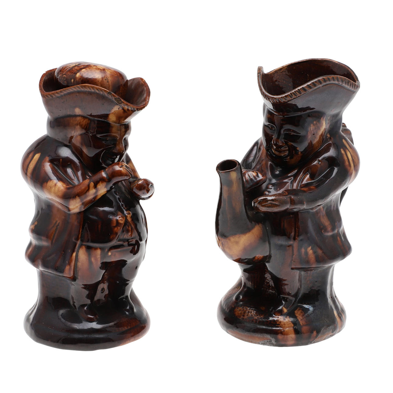 TWO 19TH CENTURY TREACLE GLAZE POTTERY TOBY JUGS.