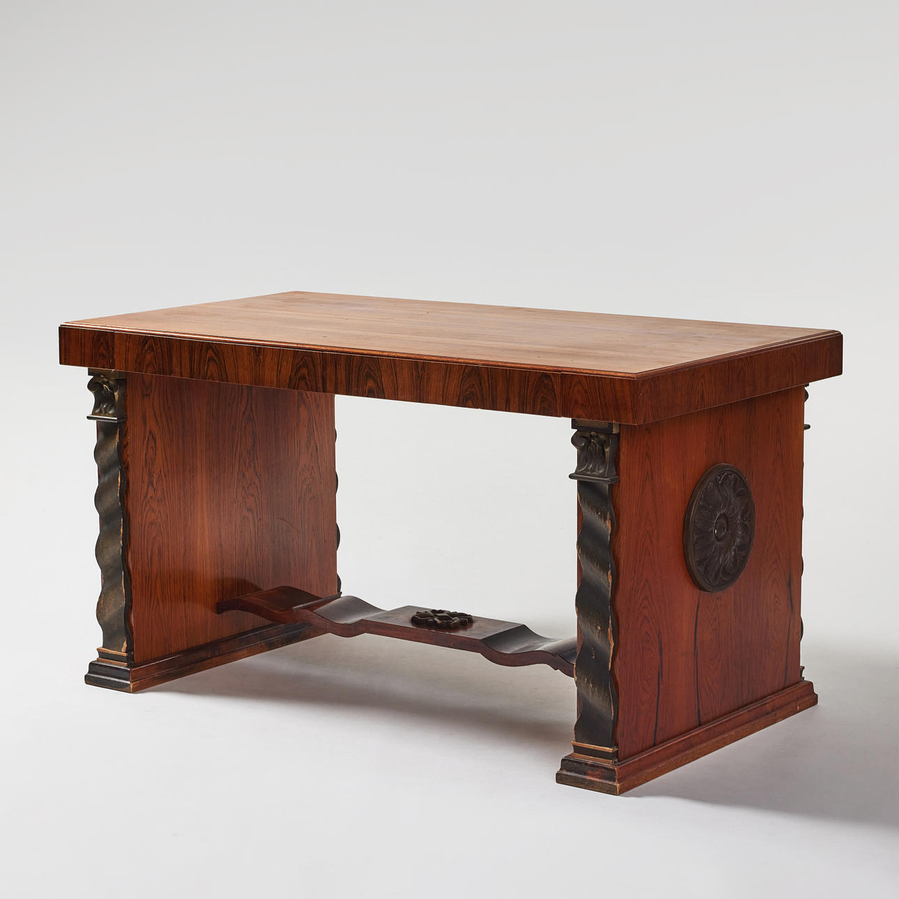 A Swedish Grace 1920/30's library table, veneered in walnut, linked leg ...