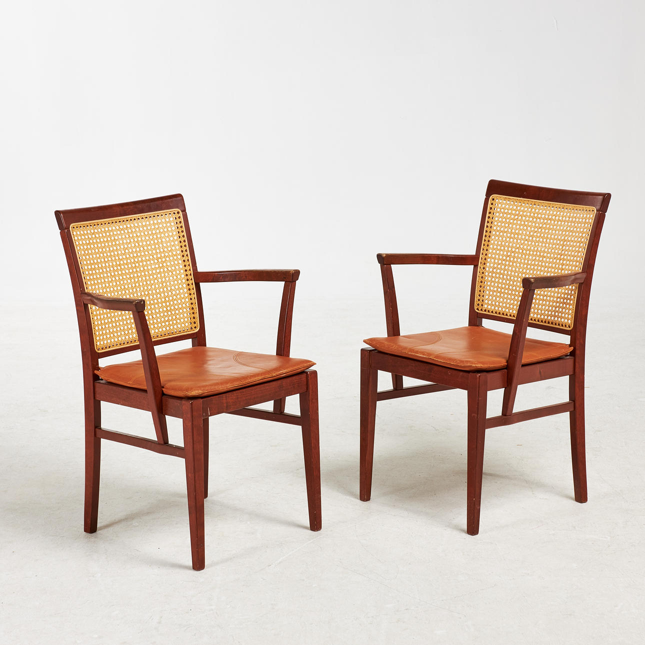 ARMCHAIRS, 1 pair, Congac leather, rattan.