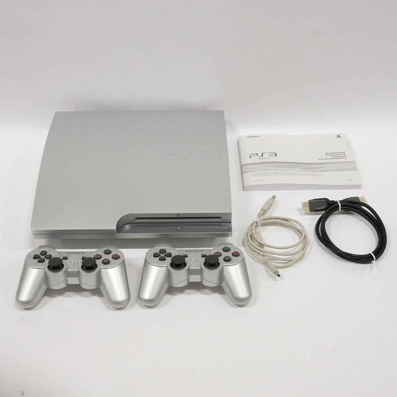 GAME CONSOLE, SONY, PLAYSTATION 3 AND TWO CONSOLES.