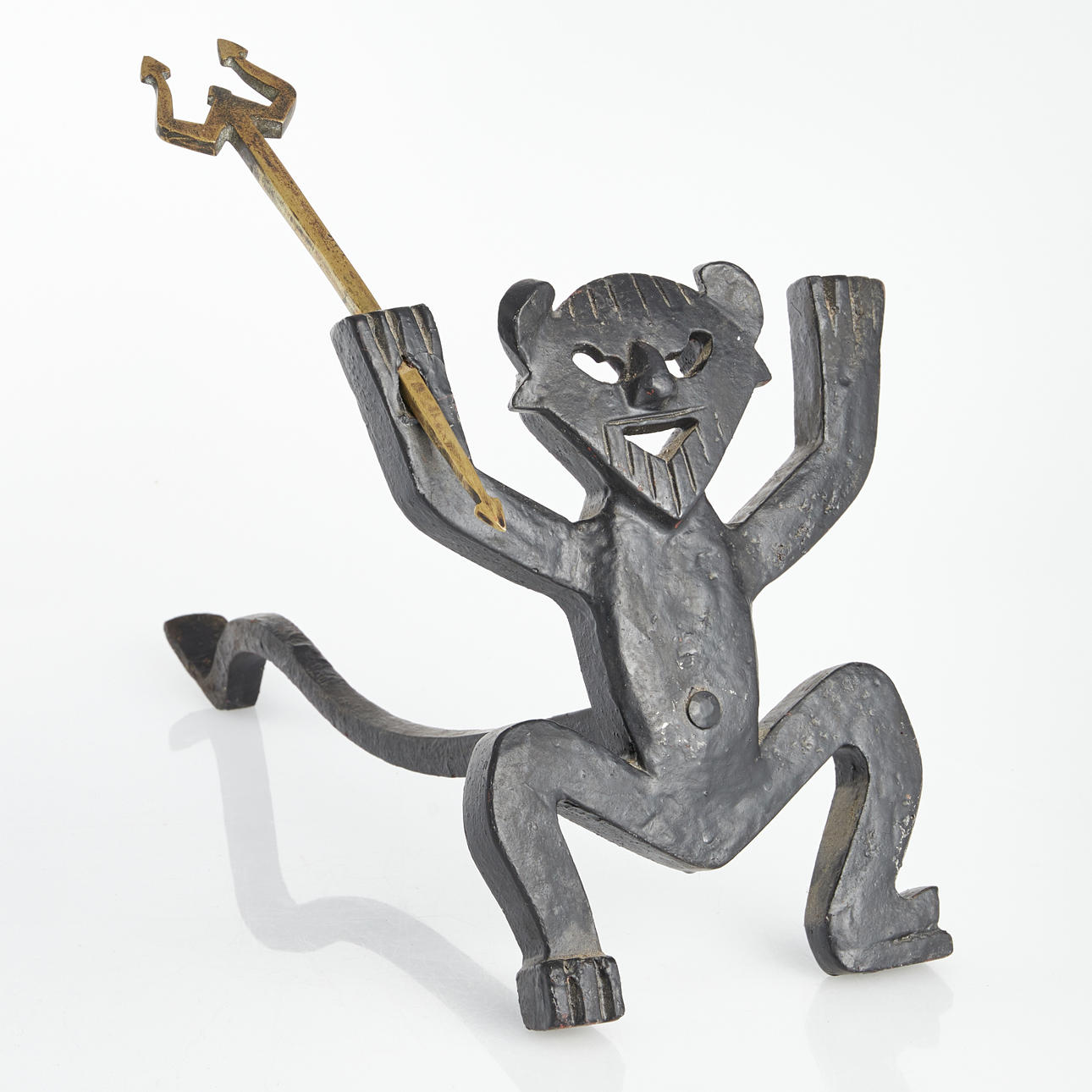 ELDHUND, gjutjärn, i form av djävul.