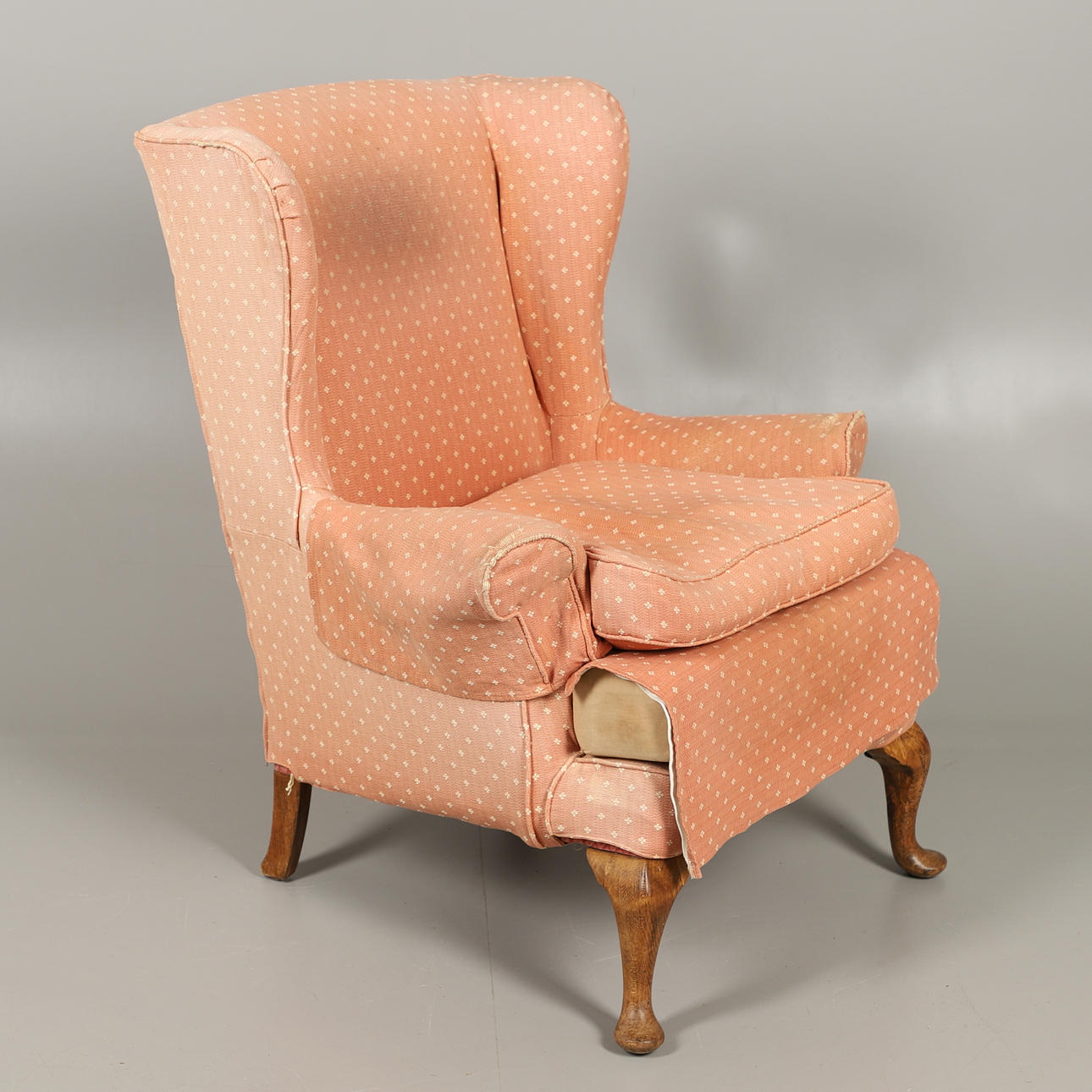 A PARKER KNOLL WING BACK CHAIR.