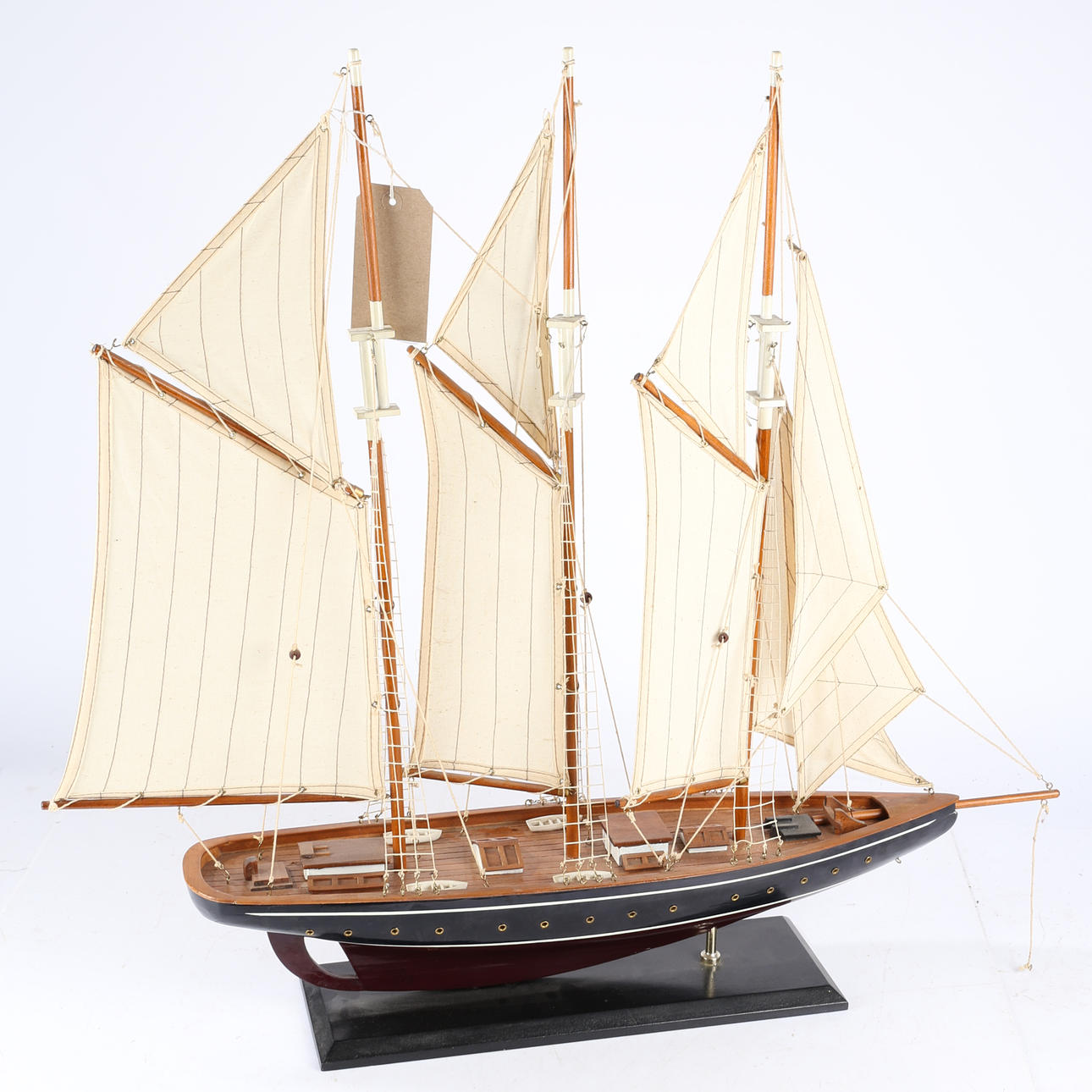 A WOODEN MODEL SHIP THREE-MASTED SCHOONER.