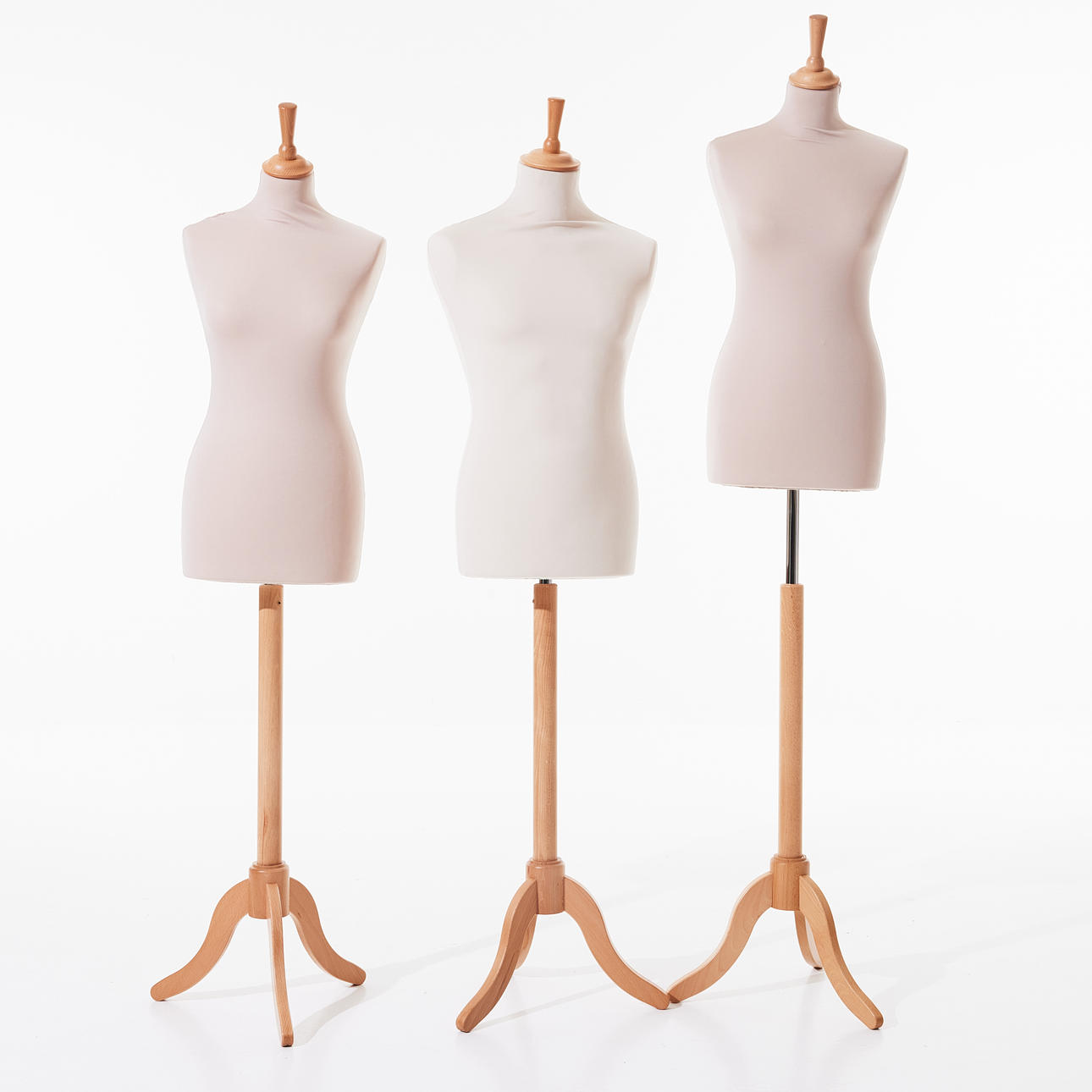 A set of 3 dummy dolls, one in men's and two in women's models, 21st century, Styrofoam upholstered in light textile, three-piece pillar base.
