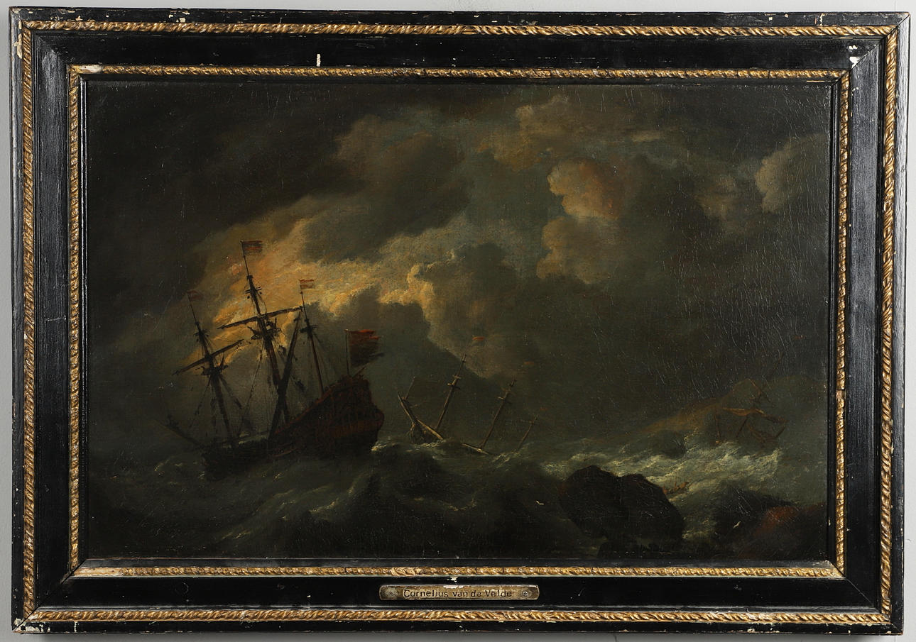 CIRCLE OF WILLEM VAN DE VELDE THE YOUNGER (1633-1707). DUTCH SHIPPING IN ROUGH SEAS OFF A ROCKY COASTLINE.