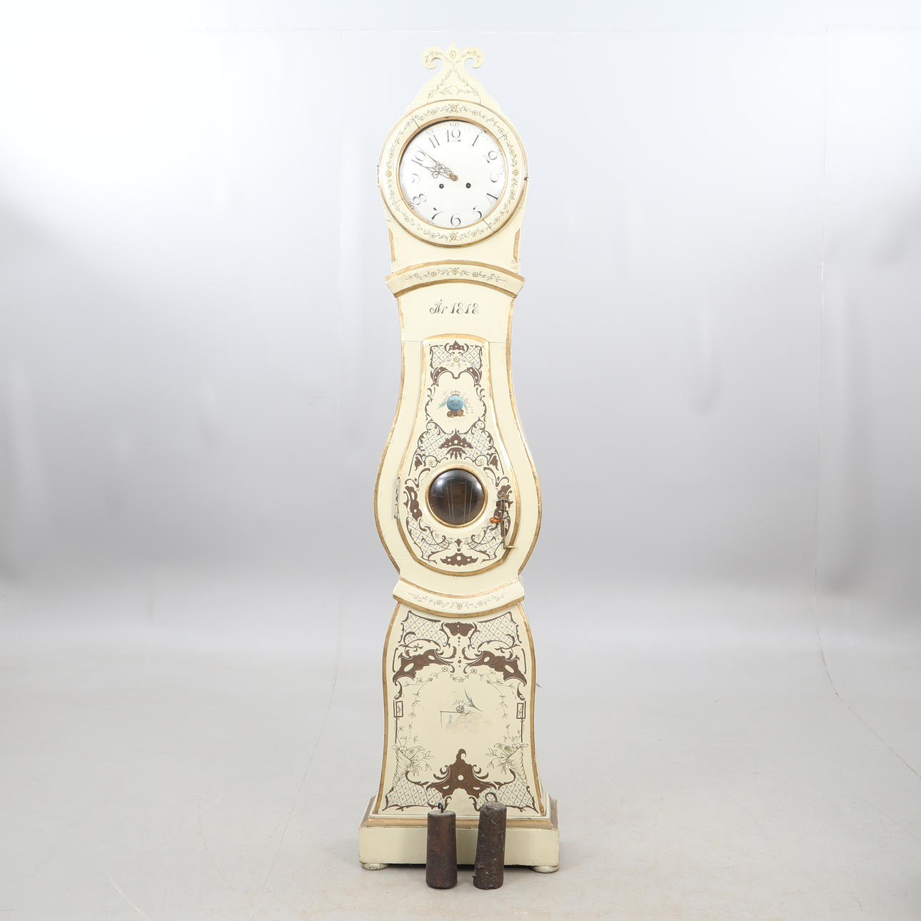 FLOOR CLOCK, dated 1818, two solders a pendulum.