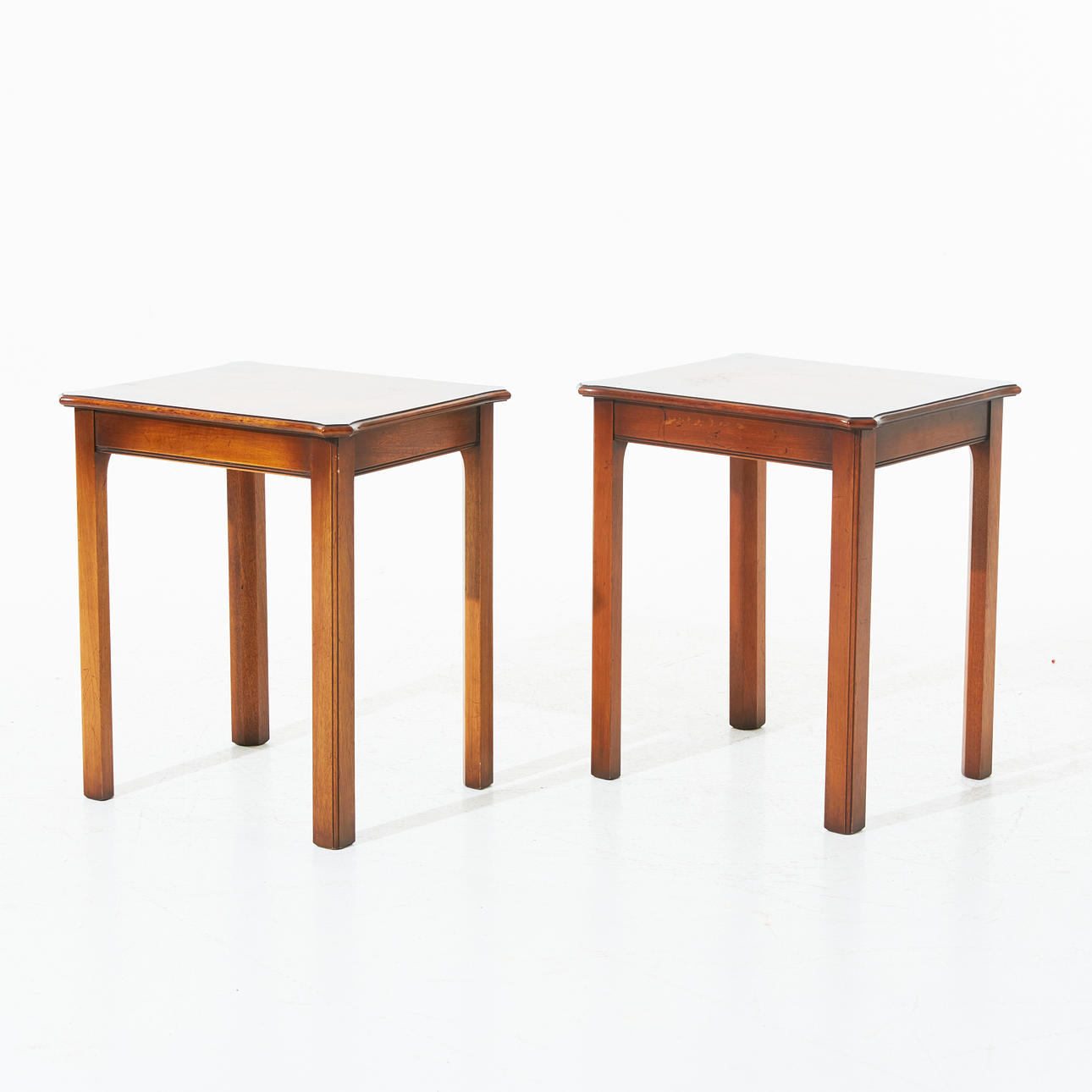 A set of two England lamp tables, second half of the 20th century, G.T. Rackstraw Worcester, yew, a label marked.