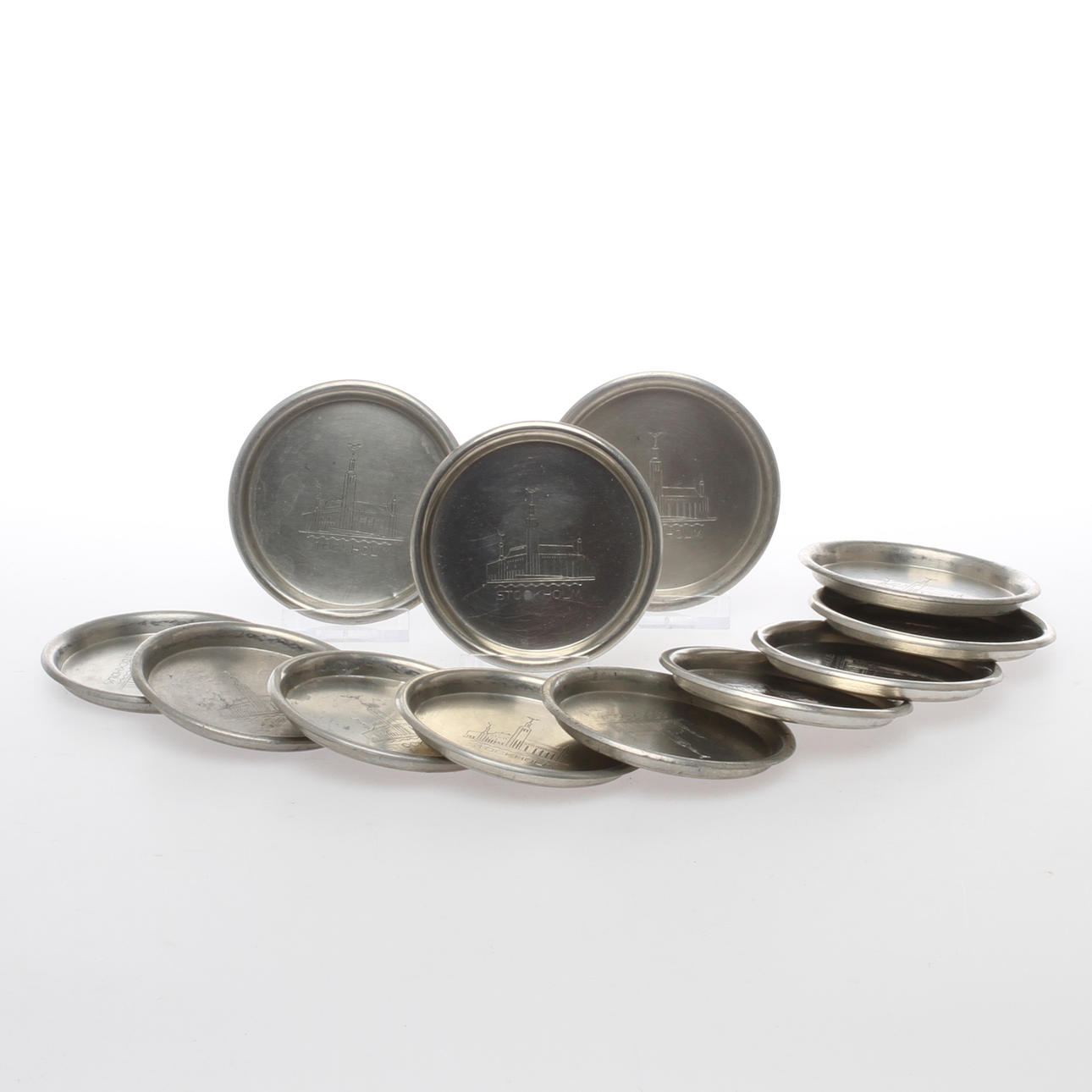 COASTERS, 12 st, tenn, motiv av Stockholms Stadshus, C G Hallberg, 1936..