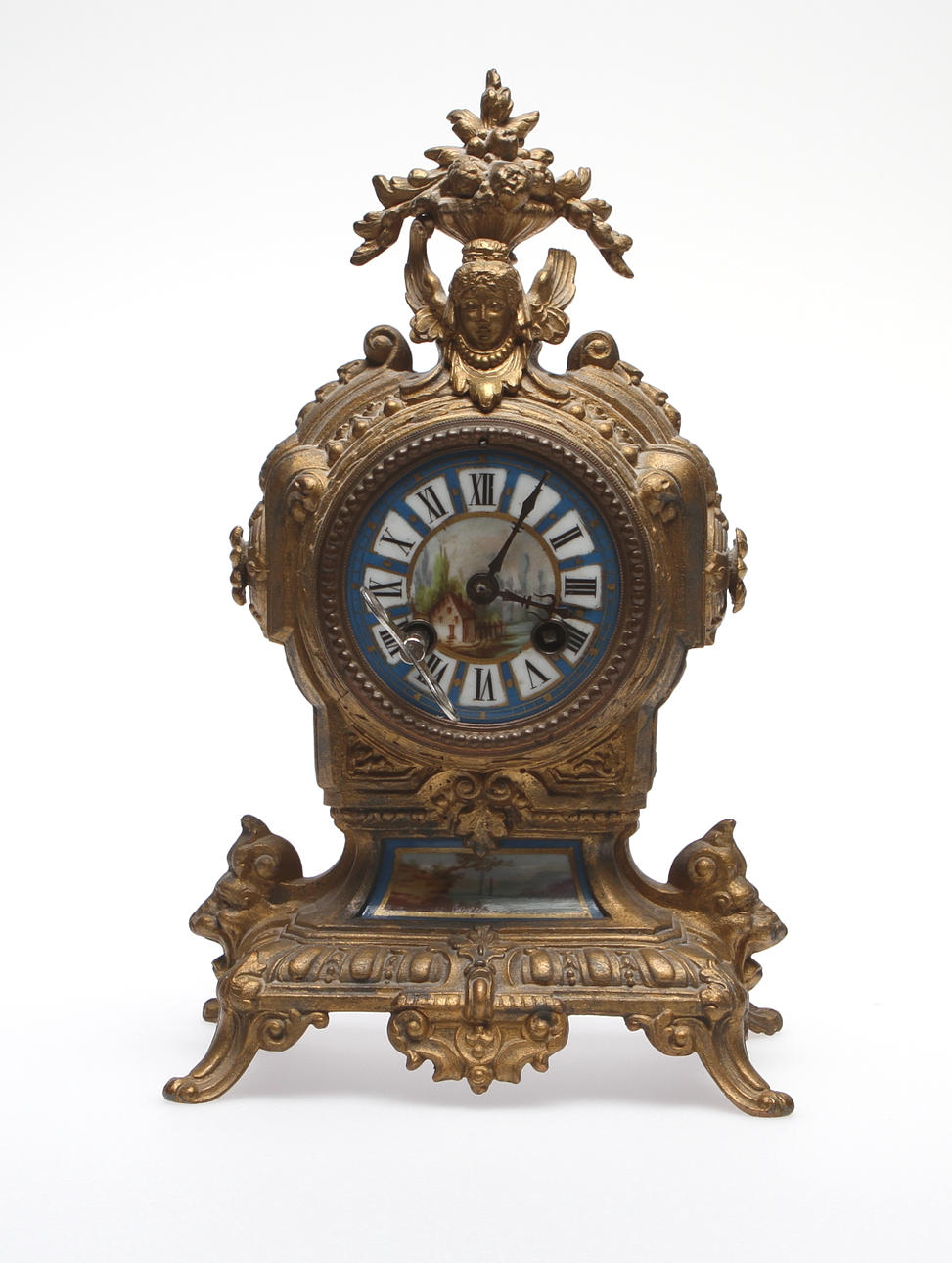 BORDSPENDYL, metall och porslin. 1800-talets slut.