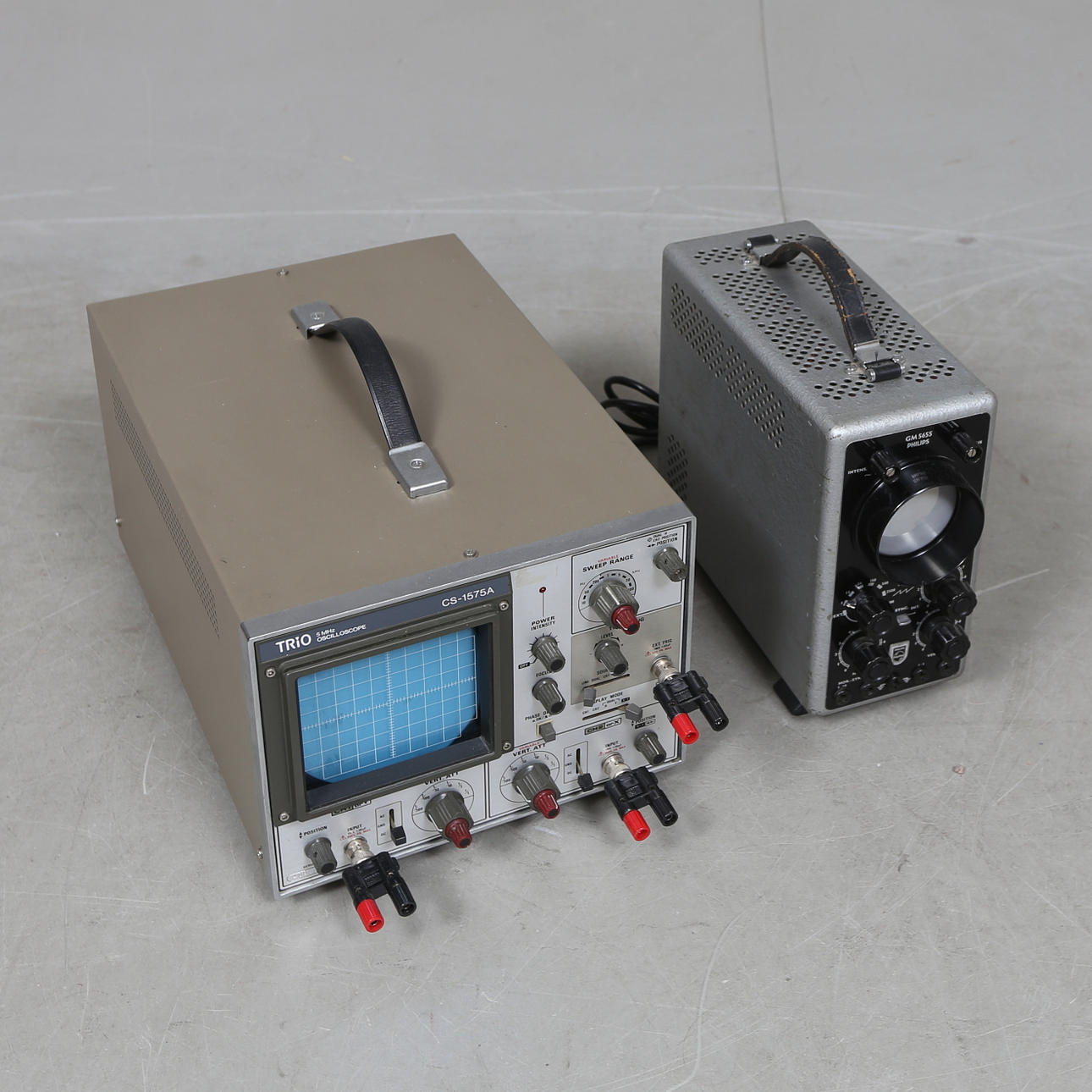 Two 20th century Philips and Trio oscilloscopes.