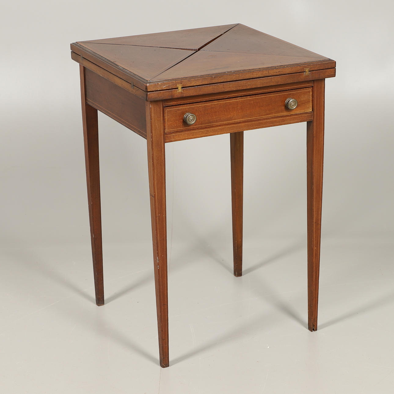 A MAHOGANY INLAID ENVELOPE CARD TABLE.