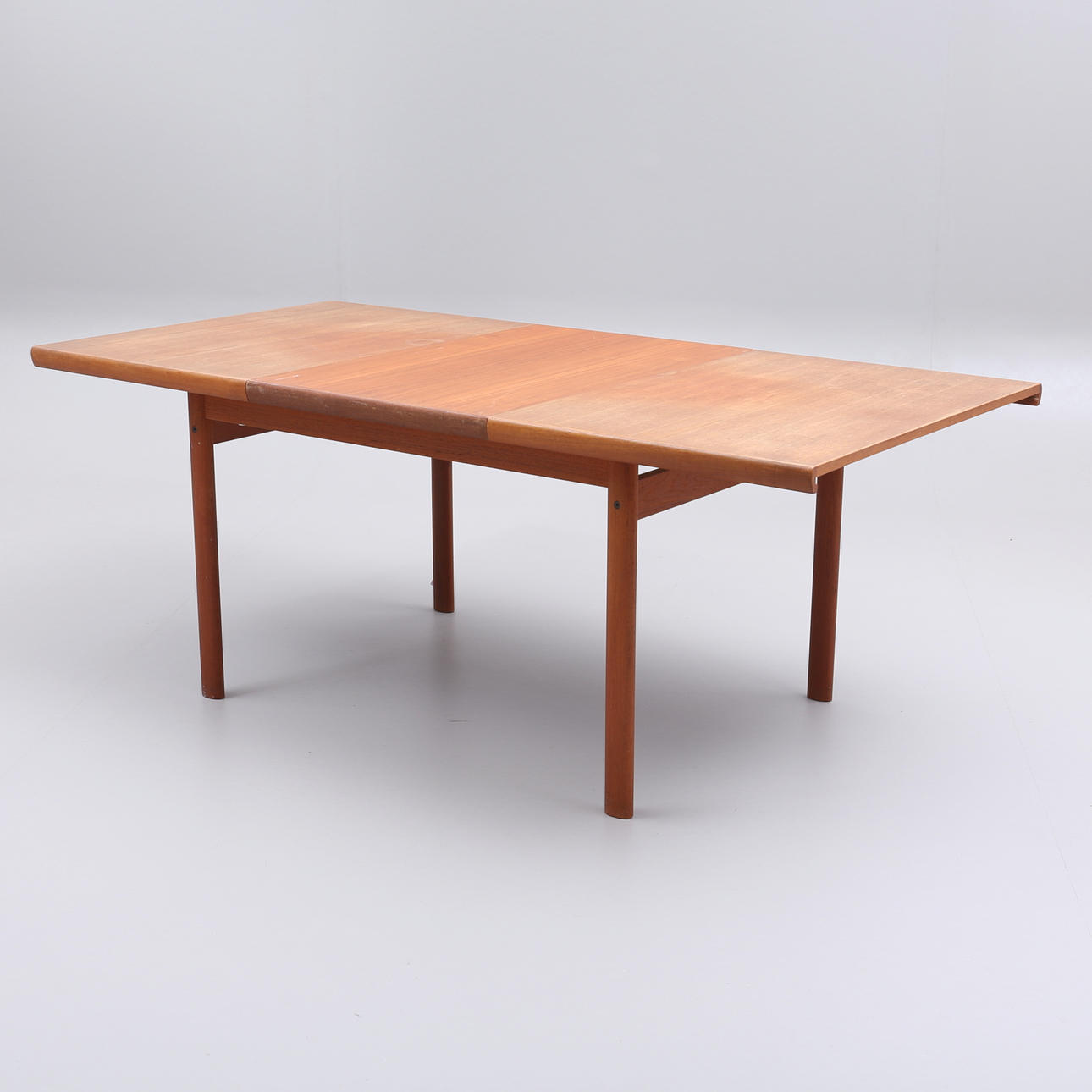 A teak dining table, circa mid 20th century.