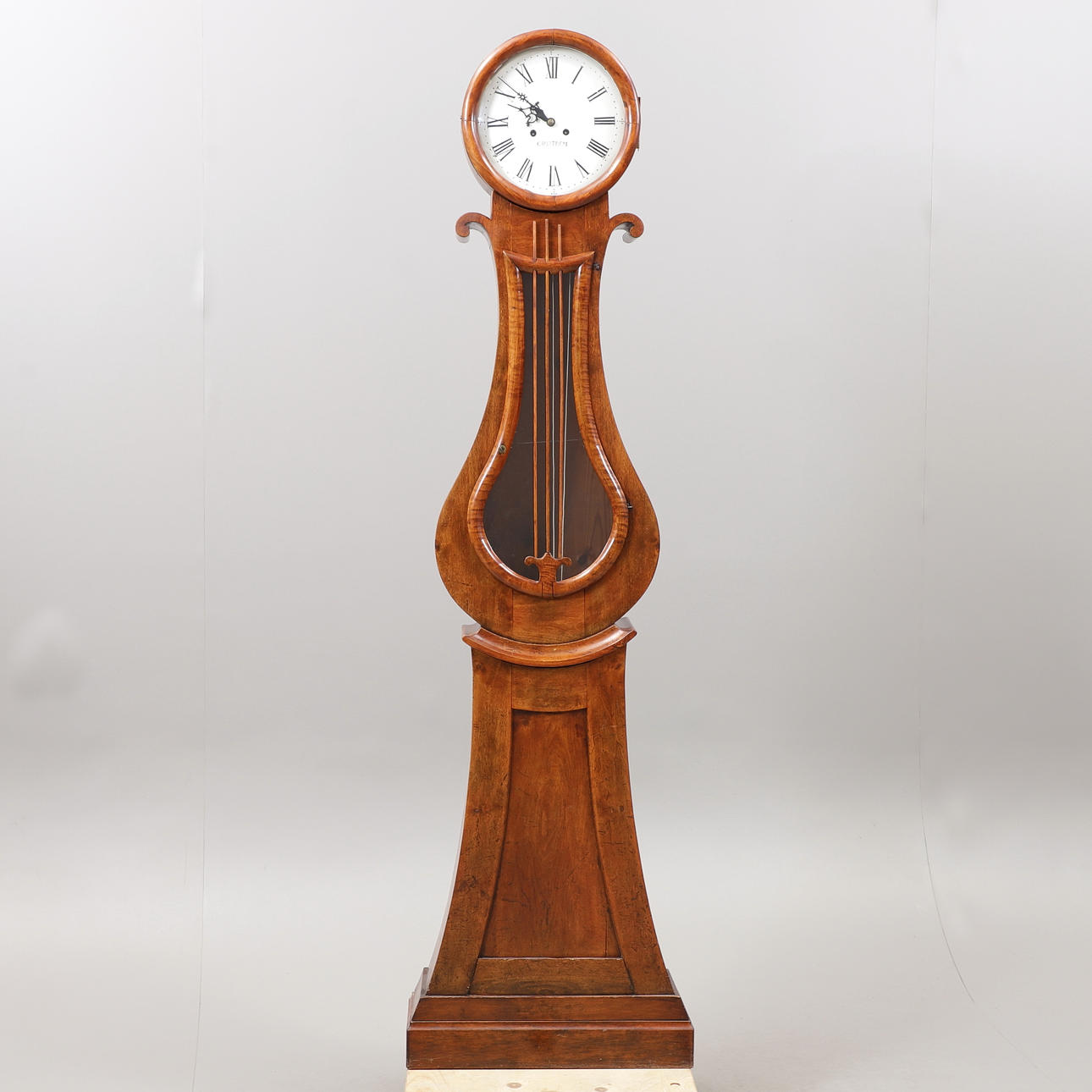 A 1850s mahogany floor clock marked “Carlström”.