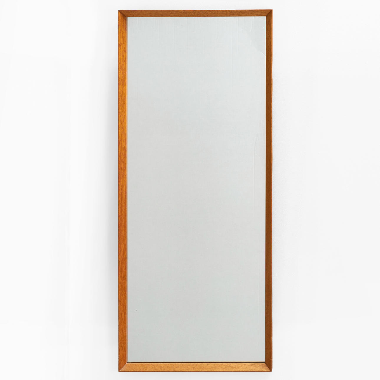 A 1960's light oak mirror.