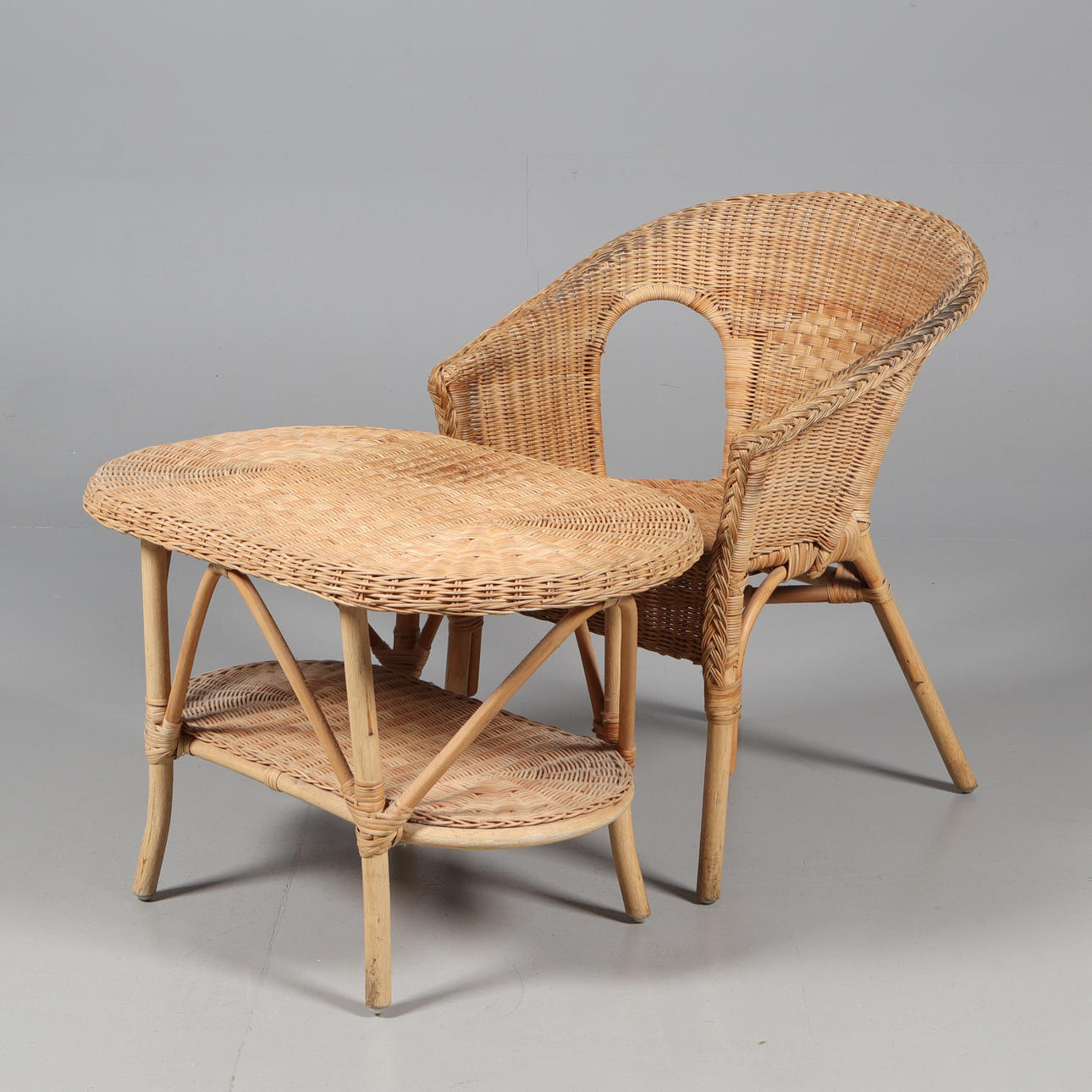 A wicker chair and table, 20th century.