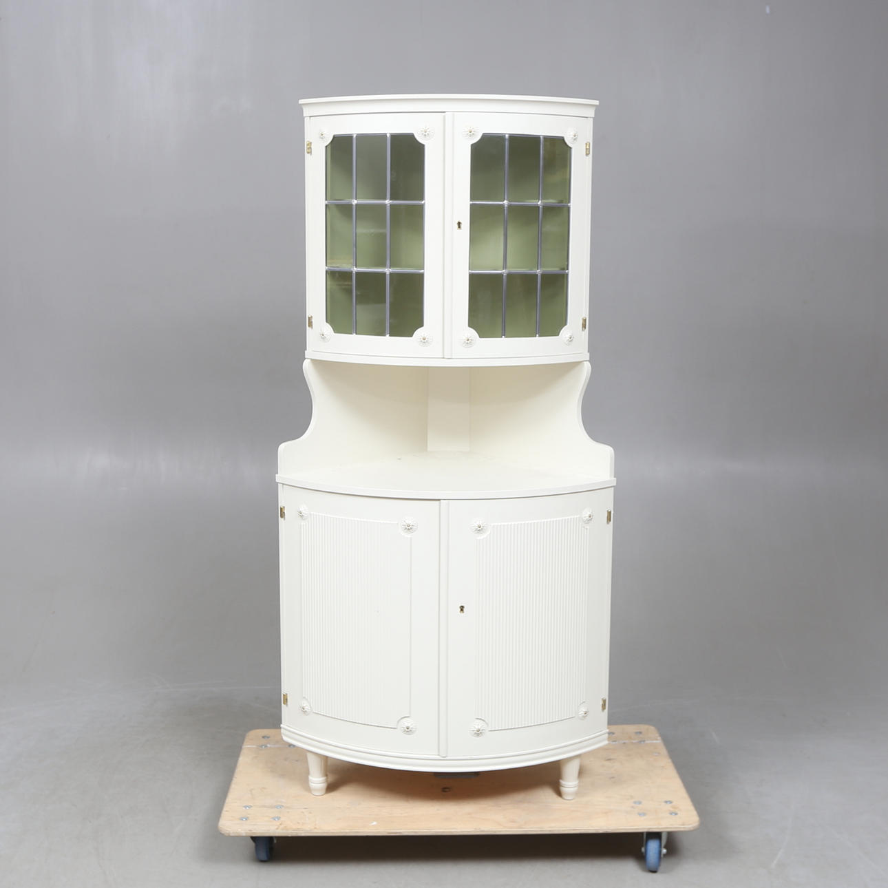 A Gustavian style corner cabinet, 20th century.