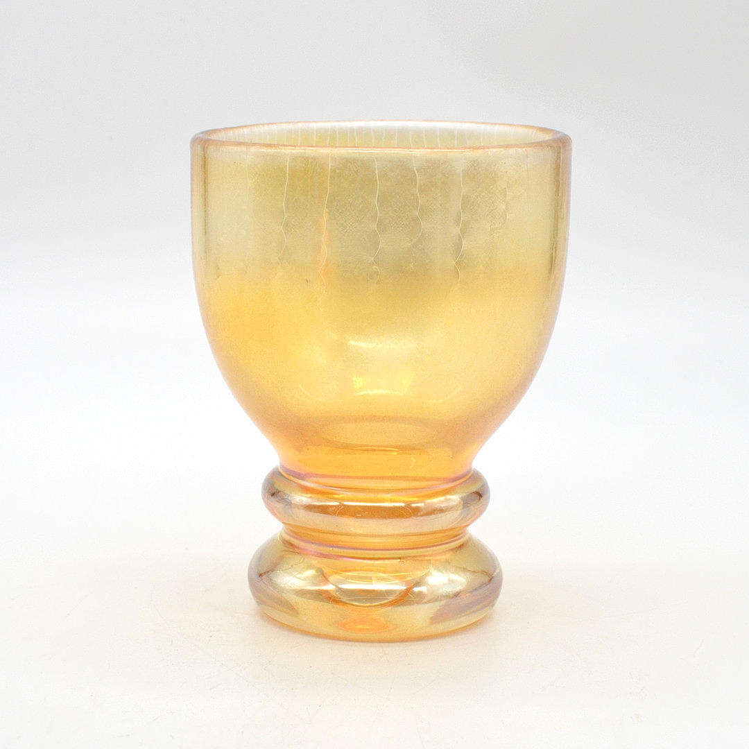 ERWIN EISCH. EISCH GLASHÜTTE, DESIGNER GLASS DRINKING CUP, ORANGE AND GOLD IRIZE, AROUND 1970S.