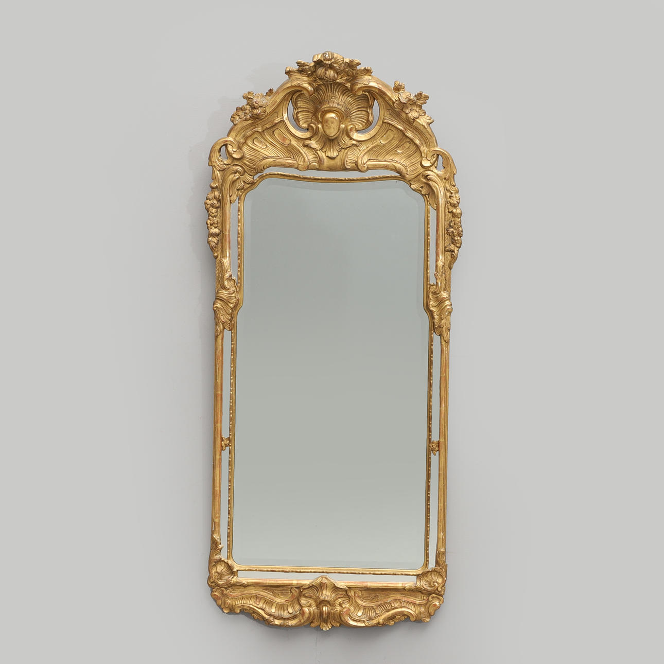 A rococo style mirror, marked CH 852, circa 1900.