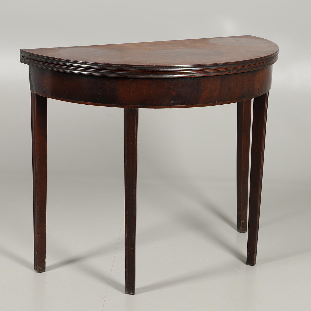 A MAHOGANY TEA TABLE.