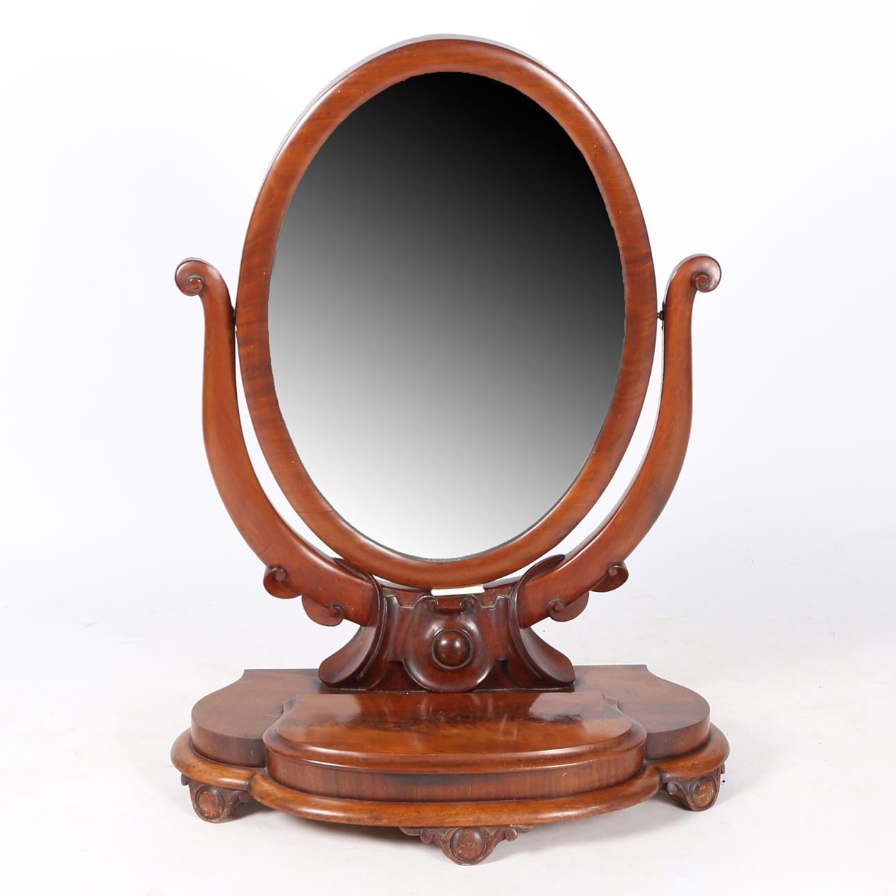 A VICTORIAN MAHOGANY OVAL DRESSING TABLE MIRROR.