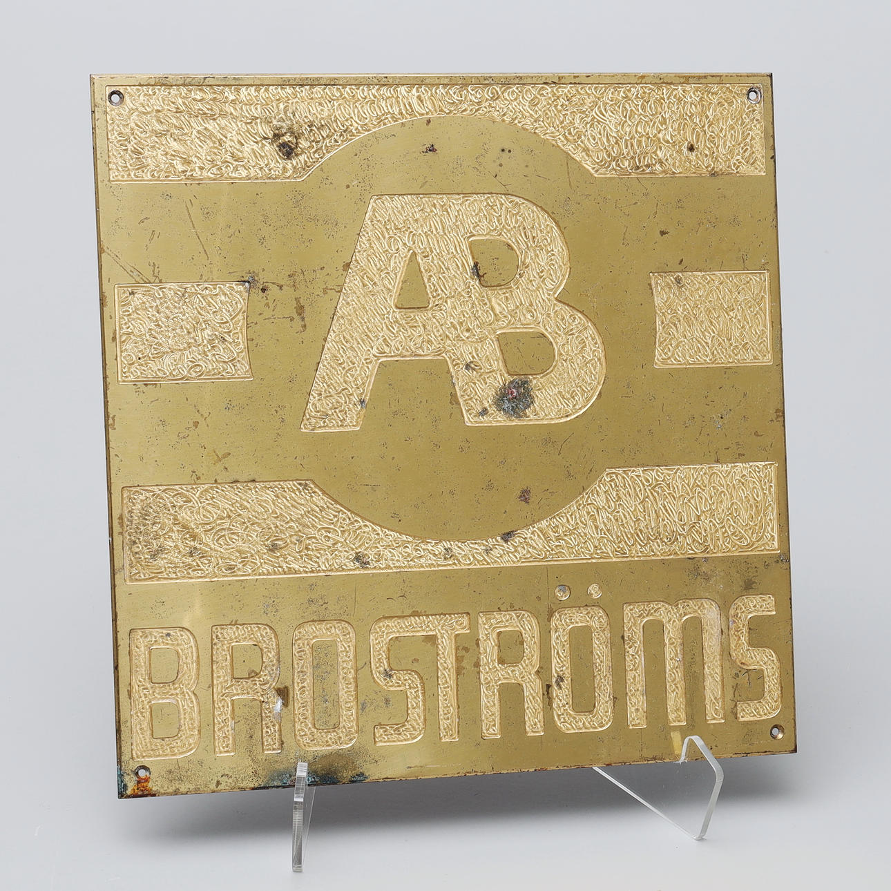 SKYLT, mässing, "Broströms AB".