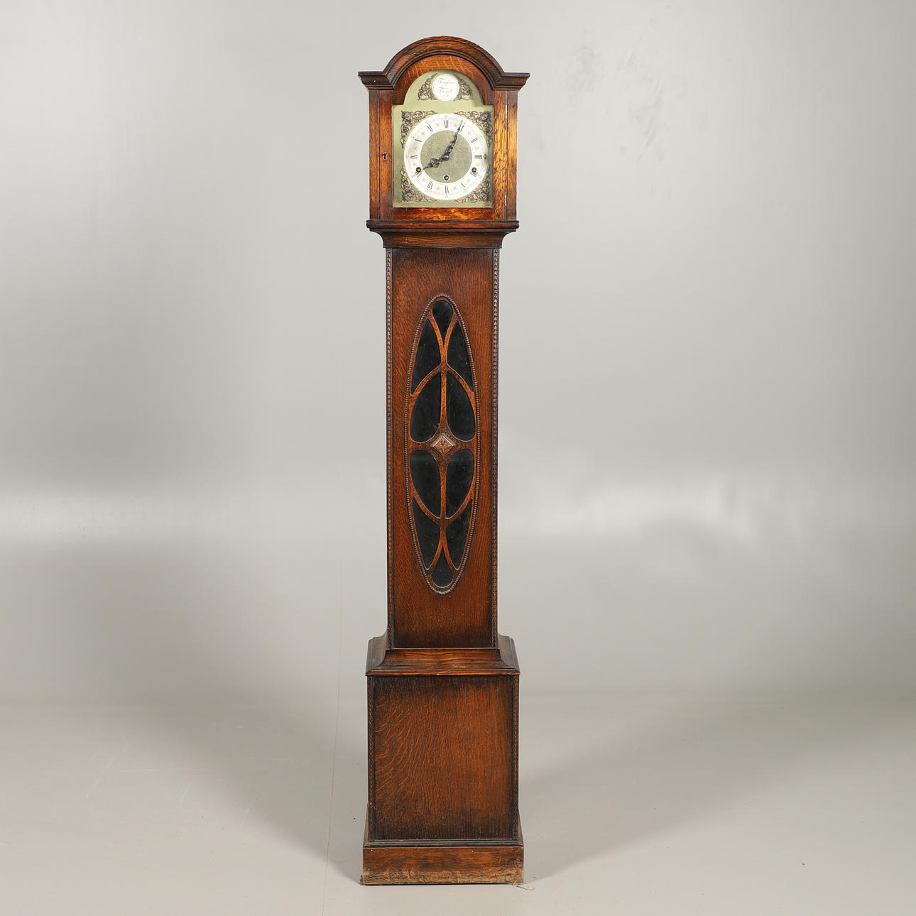 AN OAK CASED GRAND DAUGHTER CLOCK.