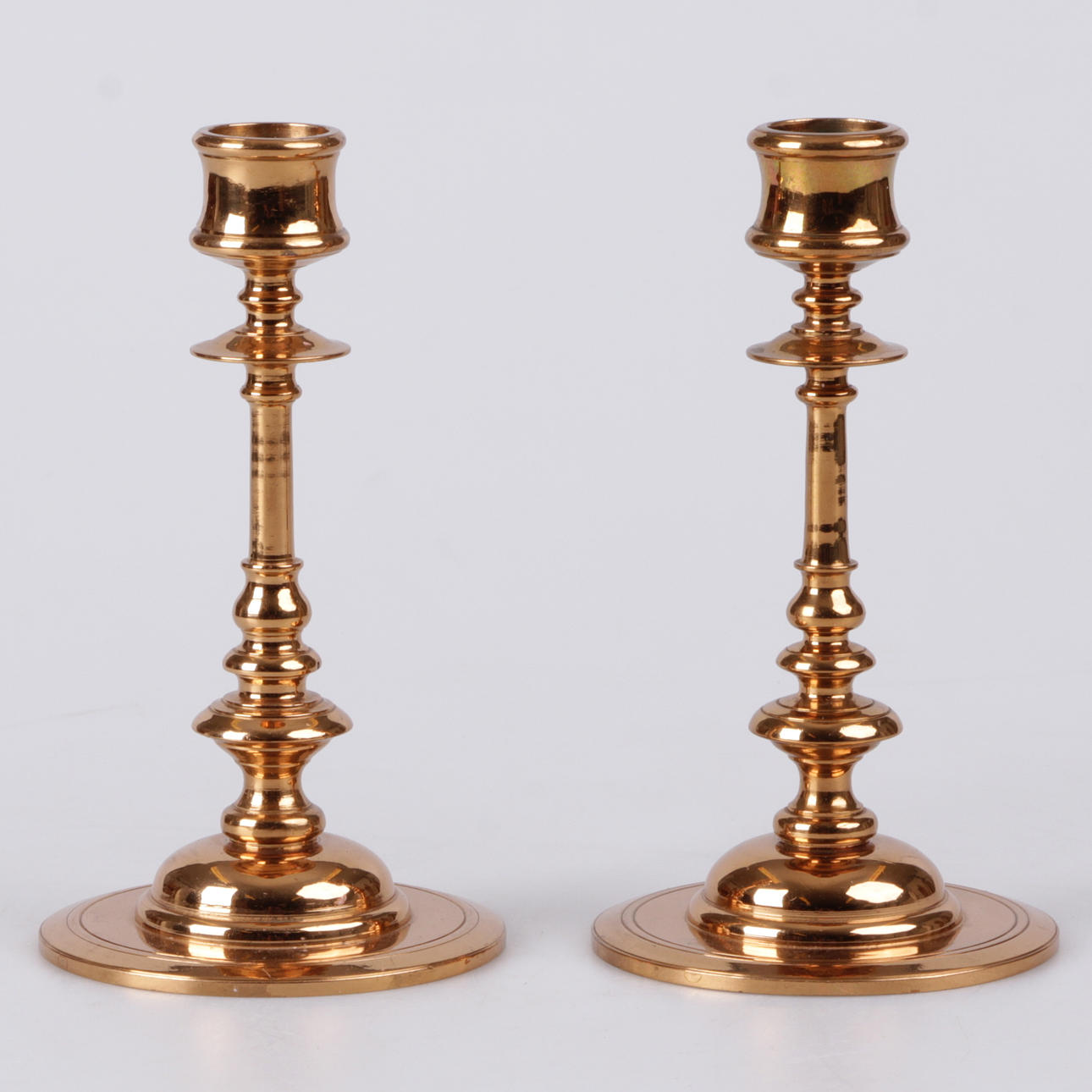 LJUSSTAKAR, ett par, malm , 1979.