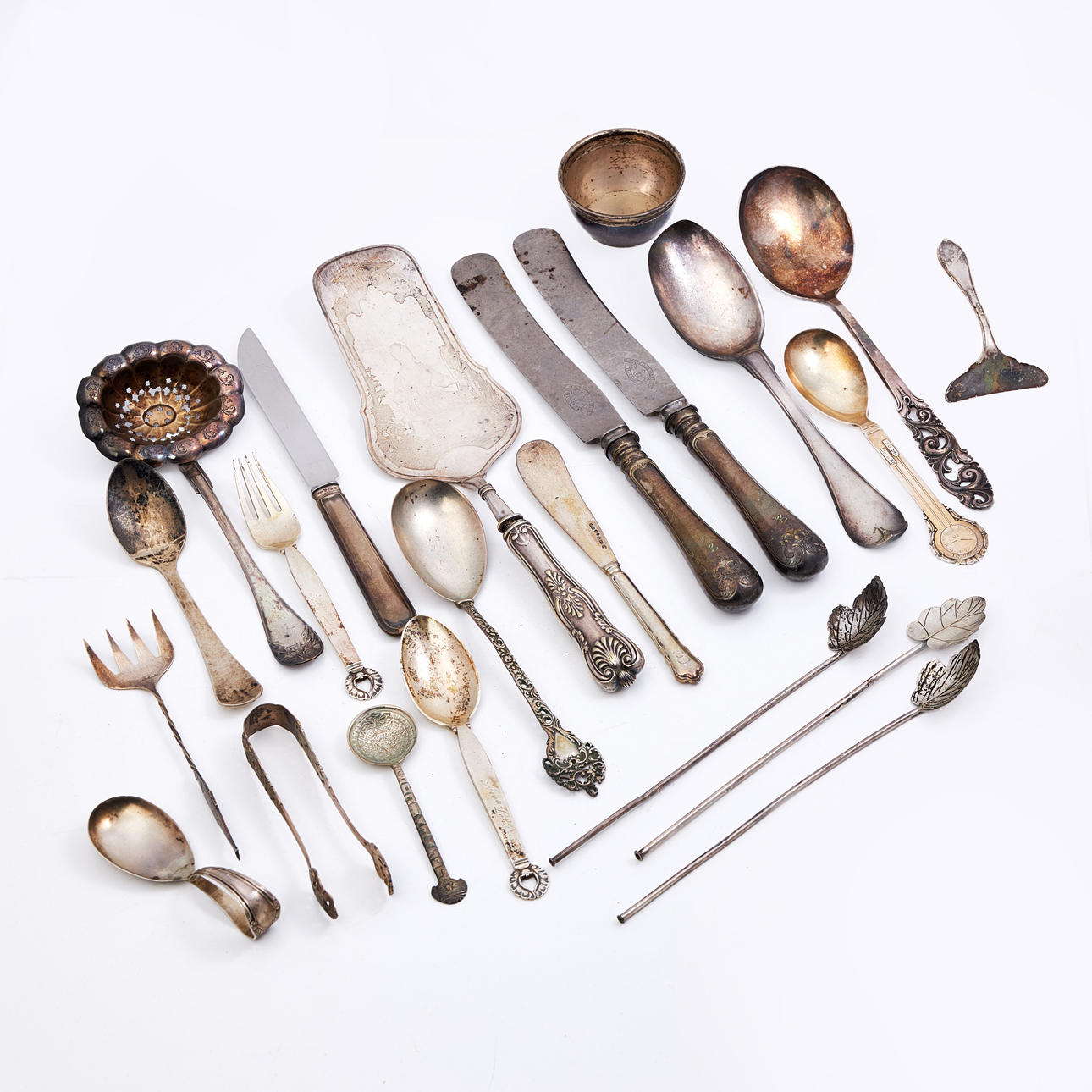 SILVER OBJECTS, 24 pcs, including cup, strainer and spoons. Silver ...