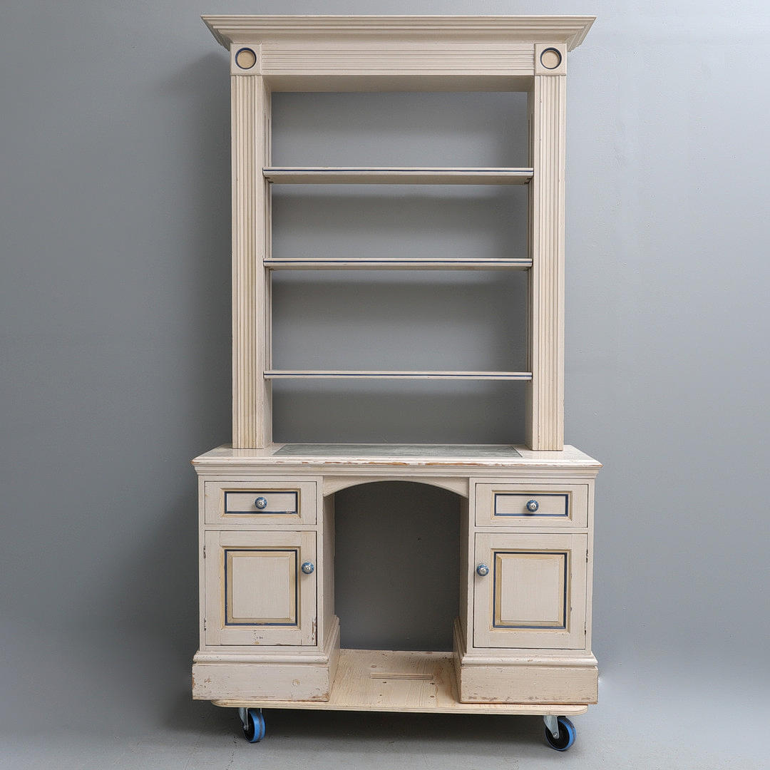 A REPRODUCTION CLASSICAL STYLE CREAM PAINTED AND DECORATED PINE BOOKCASE AND DESK.