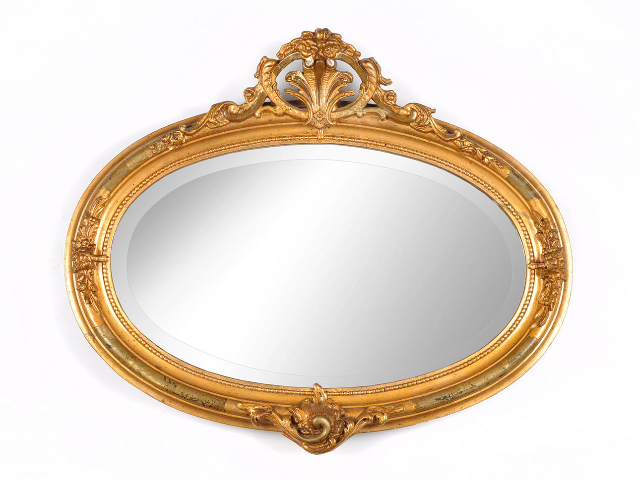 MEDAILLIONSPIEGEL. Facetterat spegelglas, daterat omkring 1930.