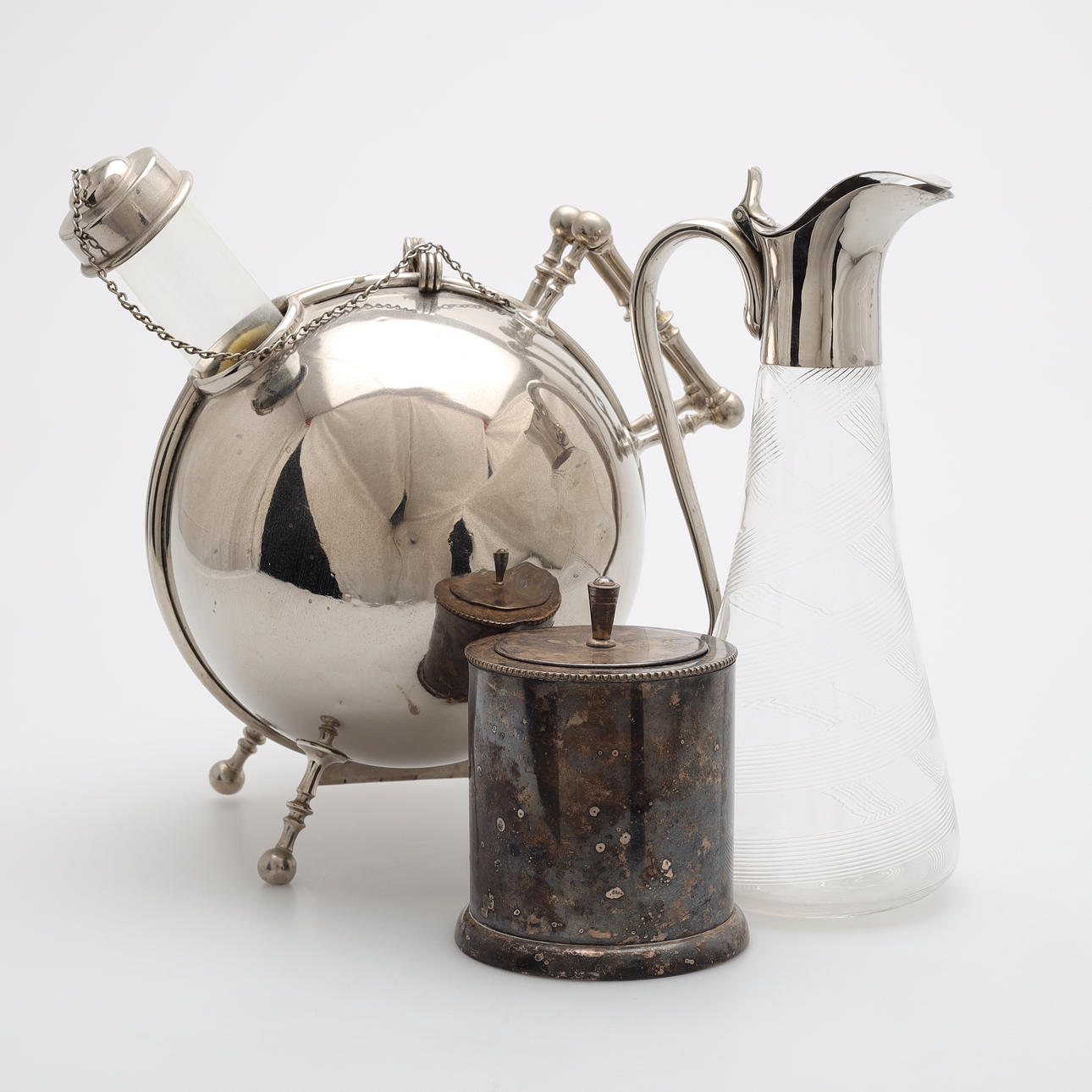 A coffee ball, decanter and tobacco jar, first half of the 20th century.  Silver & Metals - Other metals