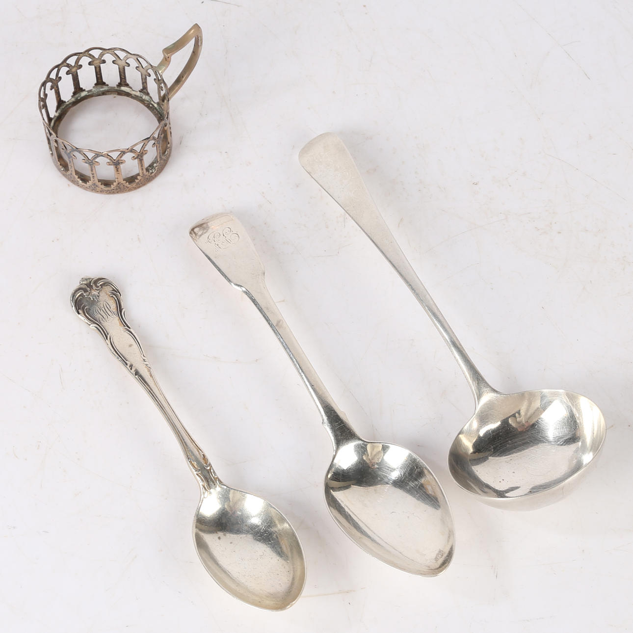 SILVER LADLE, DESSERT SPOON, TEASPOON AND CUP FRAME.