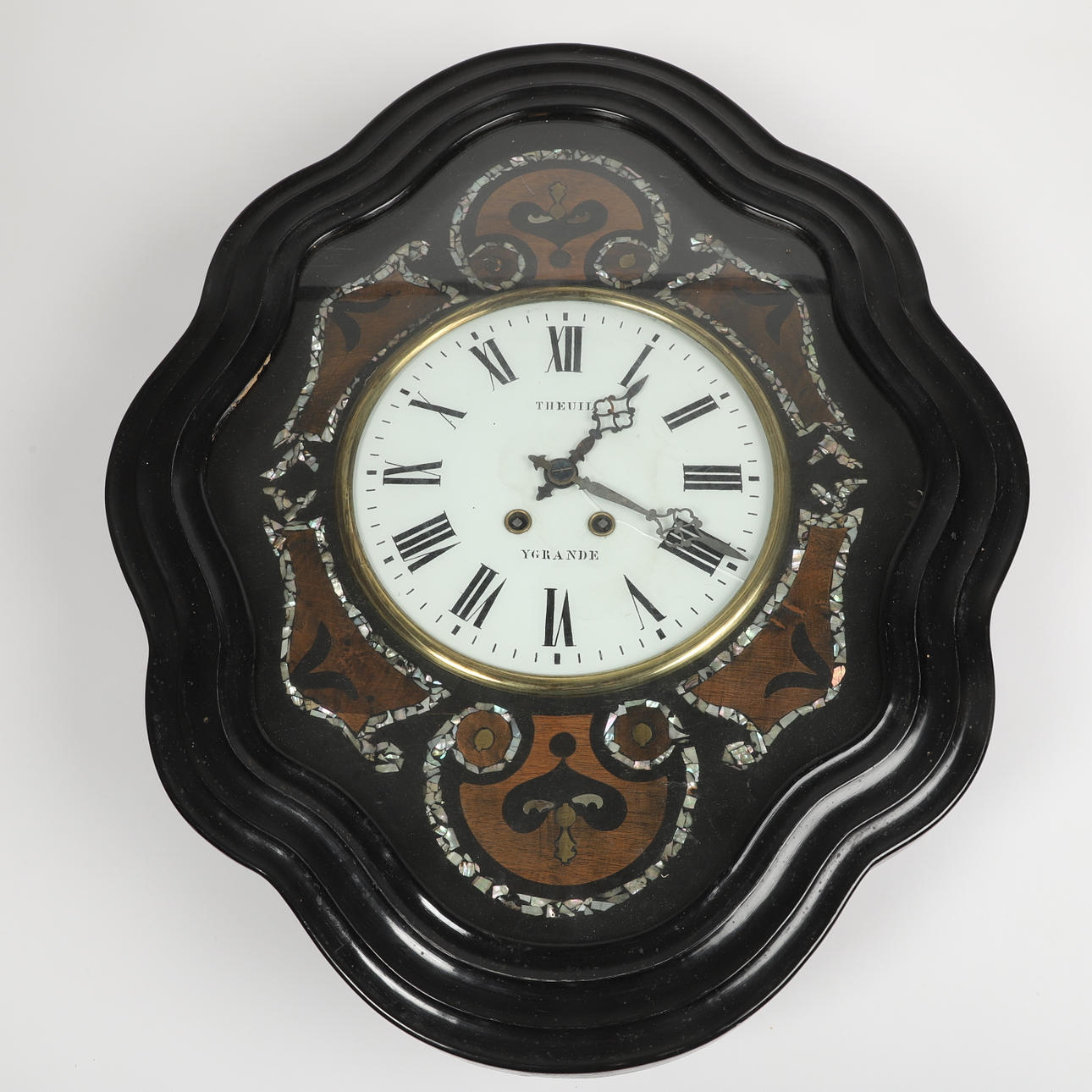 A 19th century wooden wall clock.