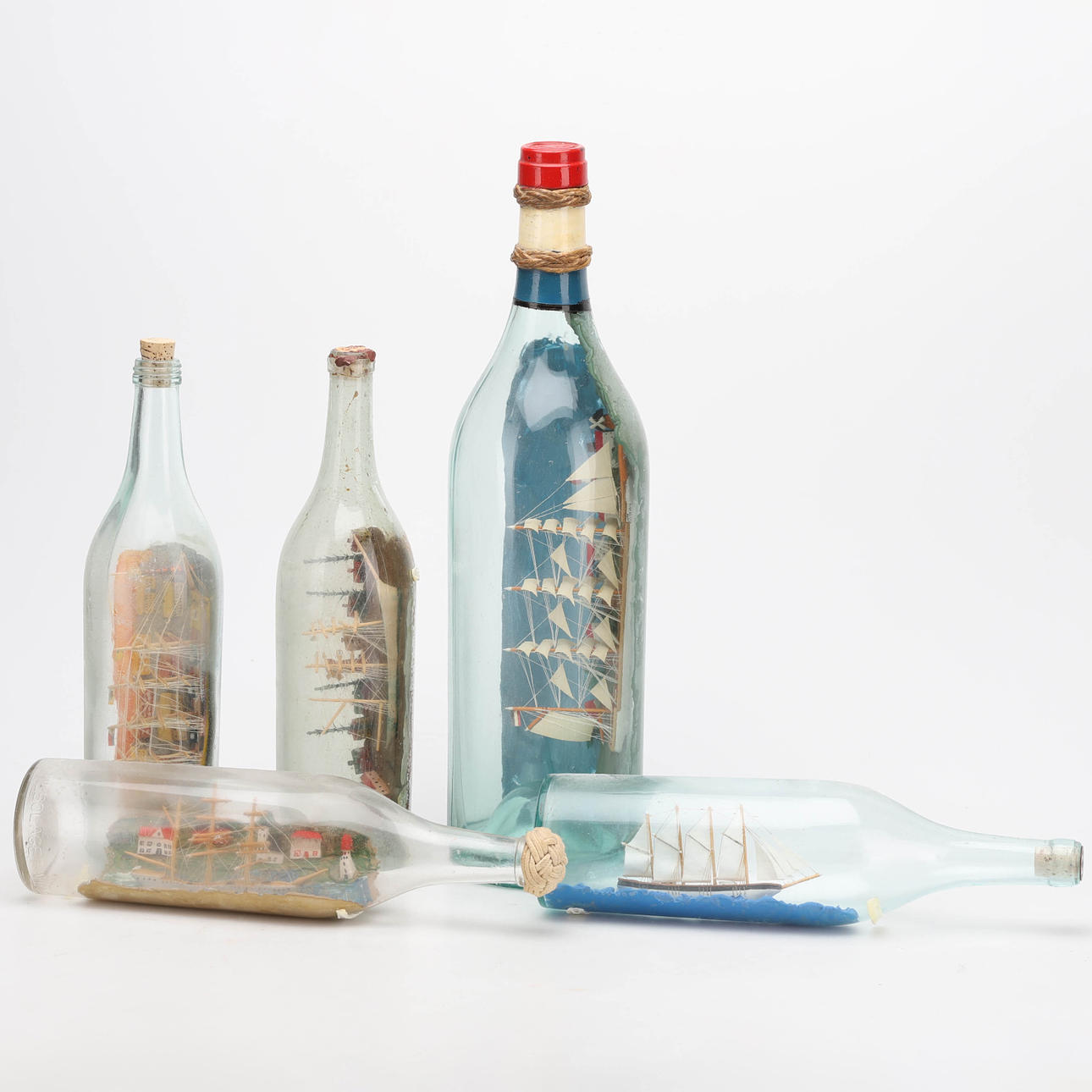 FLASCHENVERSAND, 5-tlg. 20. Jahrhundert.