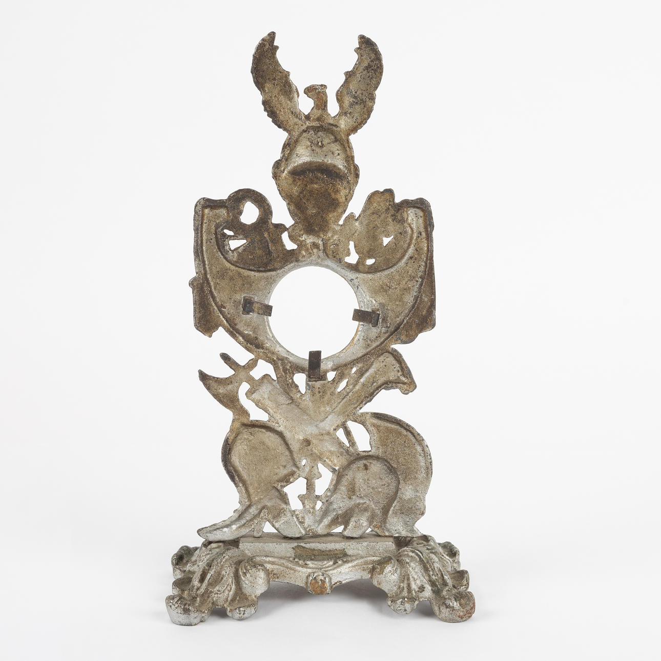 A late 19th century cast-iron pocket watch rack.