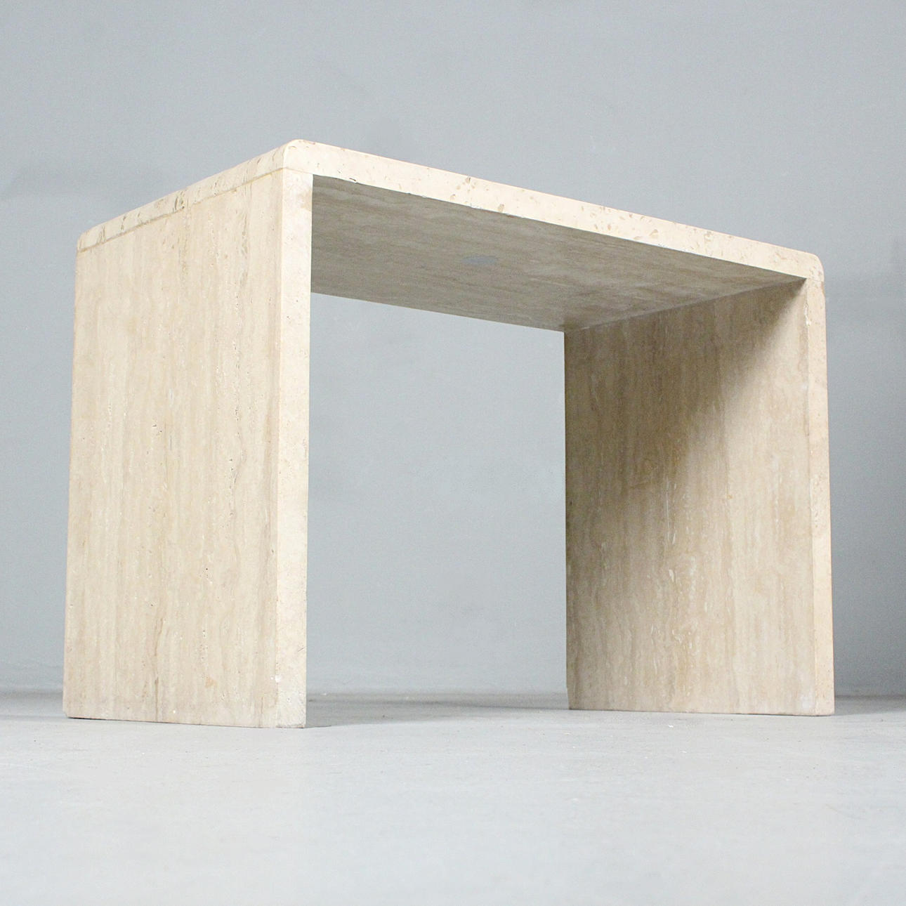 DRAINS. Side table/Travertine coffee table, 1970s.