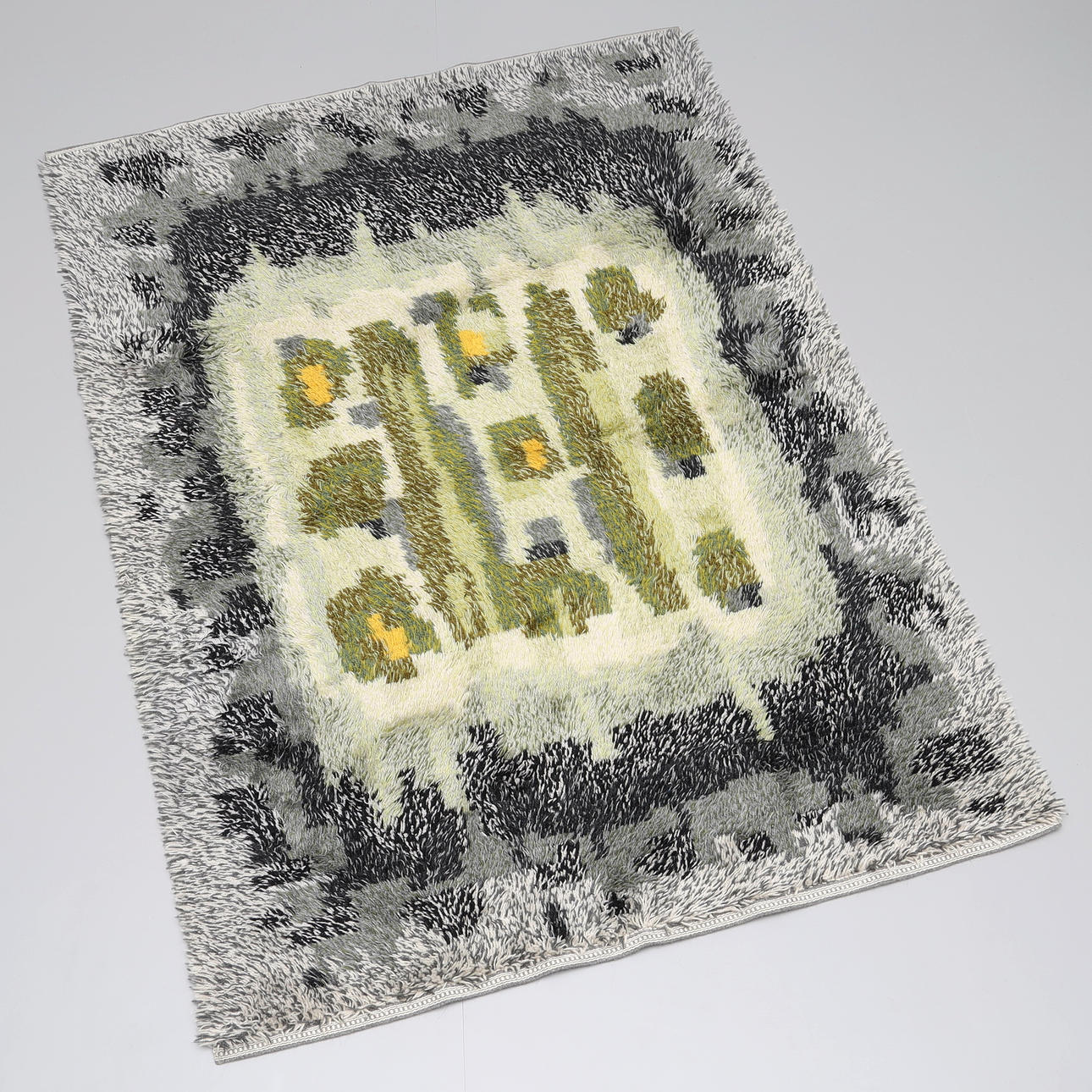 A patterned rug, mid 20th century.