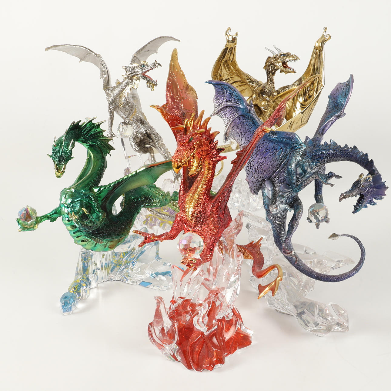 Five glass figurines, dragons, 21st century.