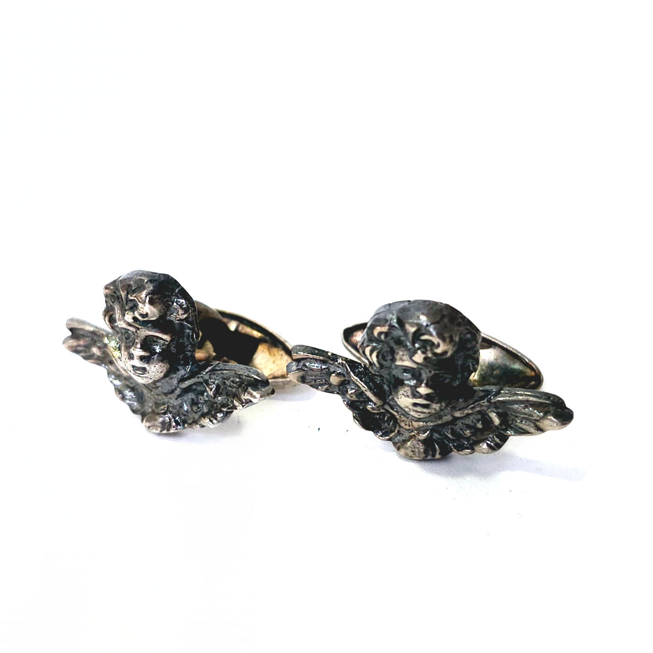 GEMELOS CON FORMA DE ÁNGELES EN PLATA. CIRCA 1900.