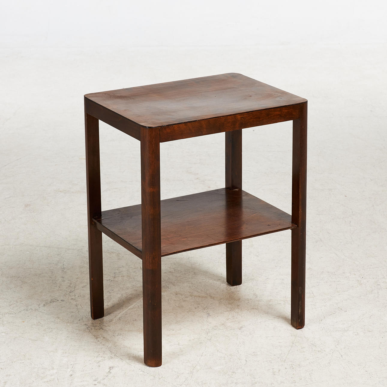 A side table, 1940s, dark stained wood.
