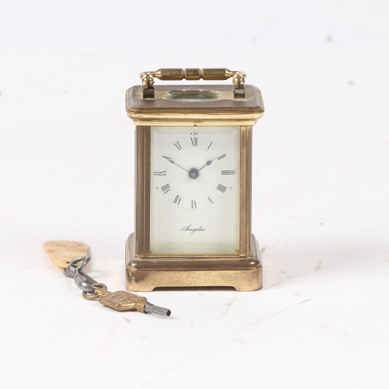 ANGELUS MINIATURE BRASS CARRIAGE CLOCK.