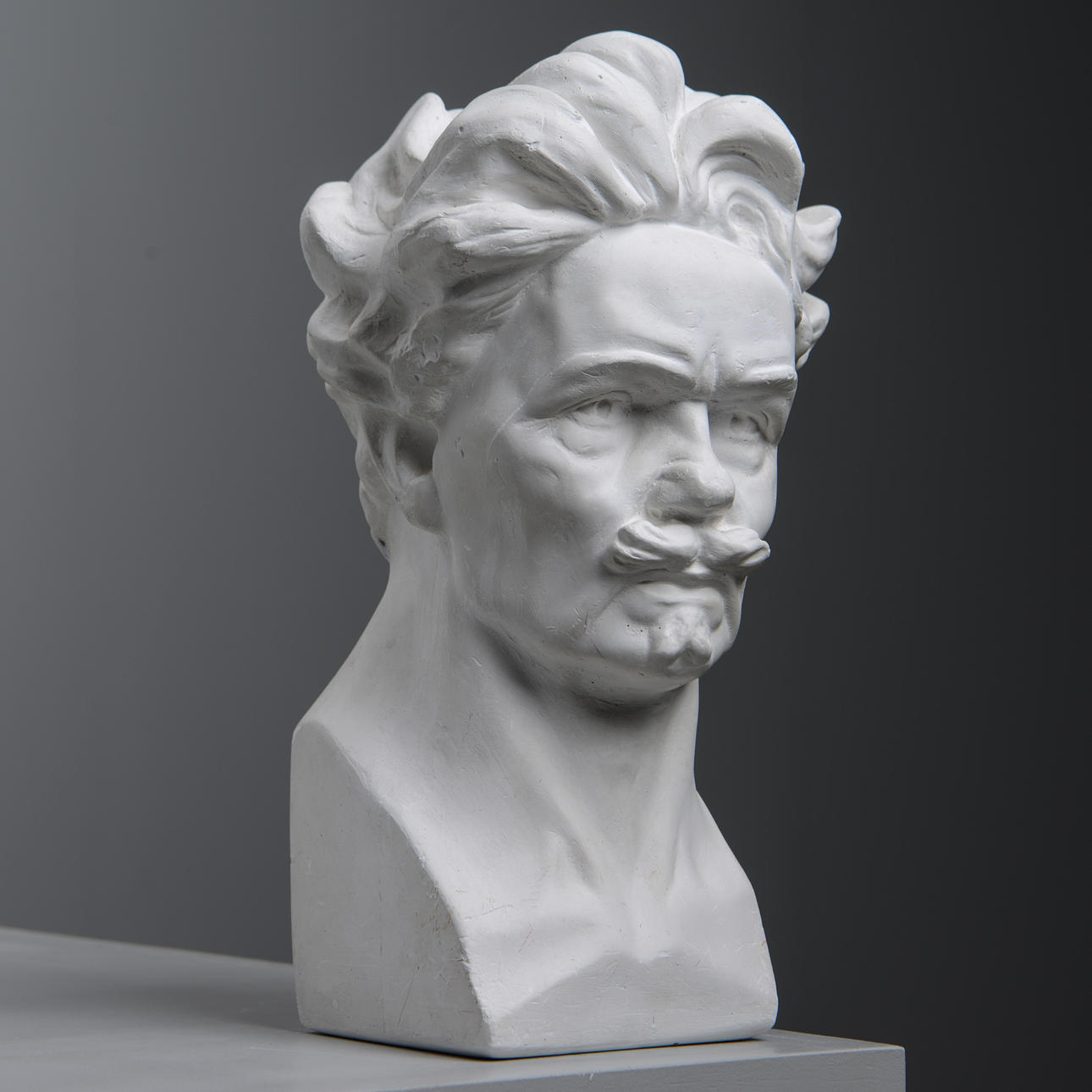 AFTER CARL ELDH. Bust depicting August Strindberg, plaster, unsigned.