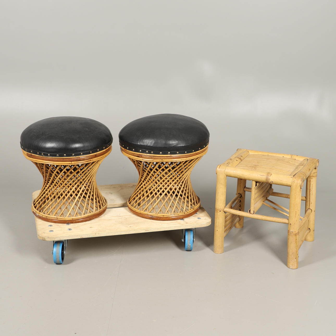 A PAIR OF WICKER MUSHROOM FORM STOOLS AND A BAMBOO STOOL.