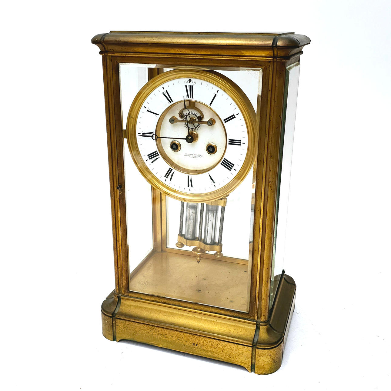 SIGNED BY GUSTAVO BERGNES. LARGE TABLE CLOCK IN BRONZE AND GLASS. MERCURY PENDULUM, ESCAPE IN THE SPHERE.