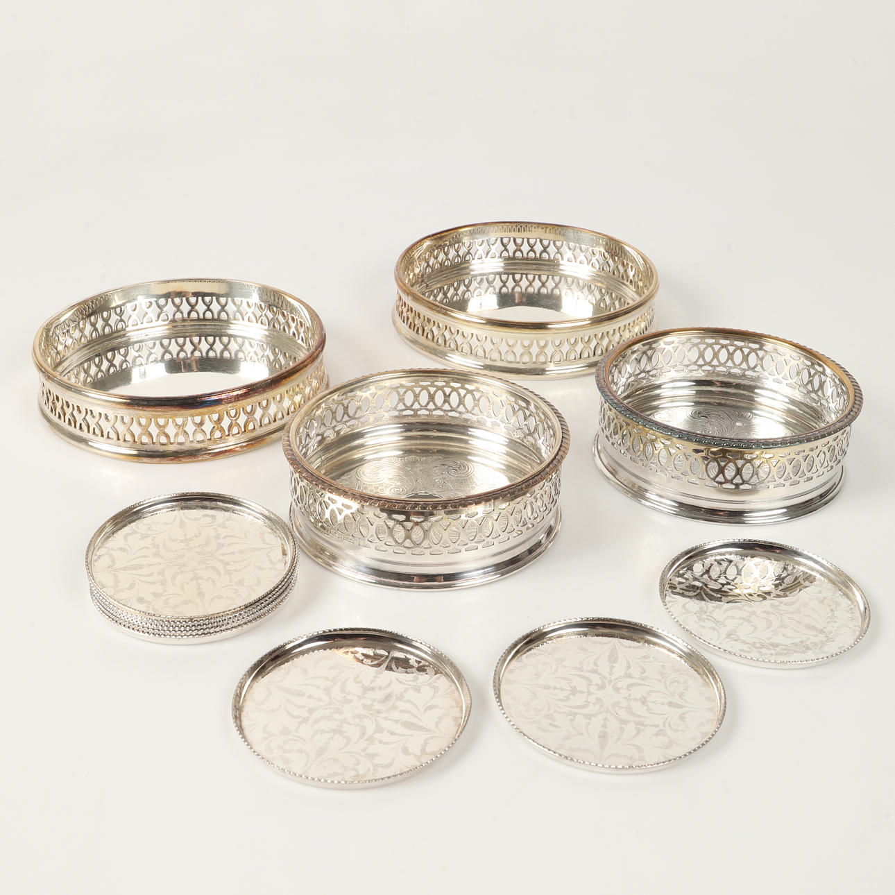 A set of 12 sterling silver coasters, England, 20th century. Silver ...