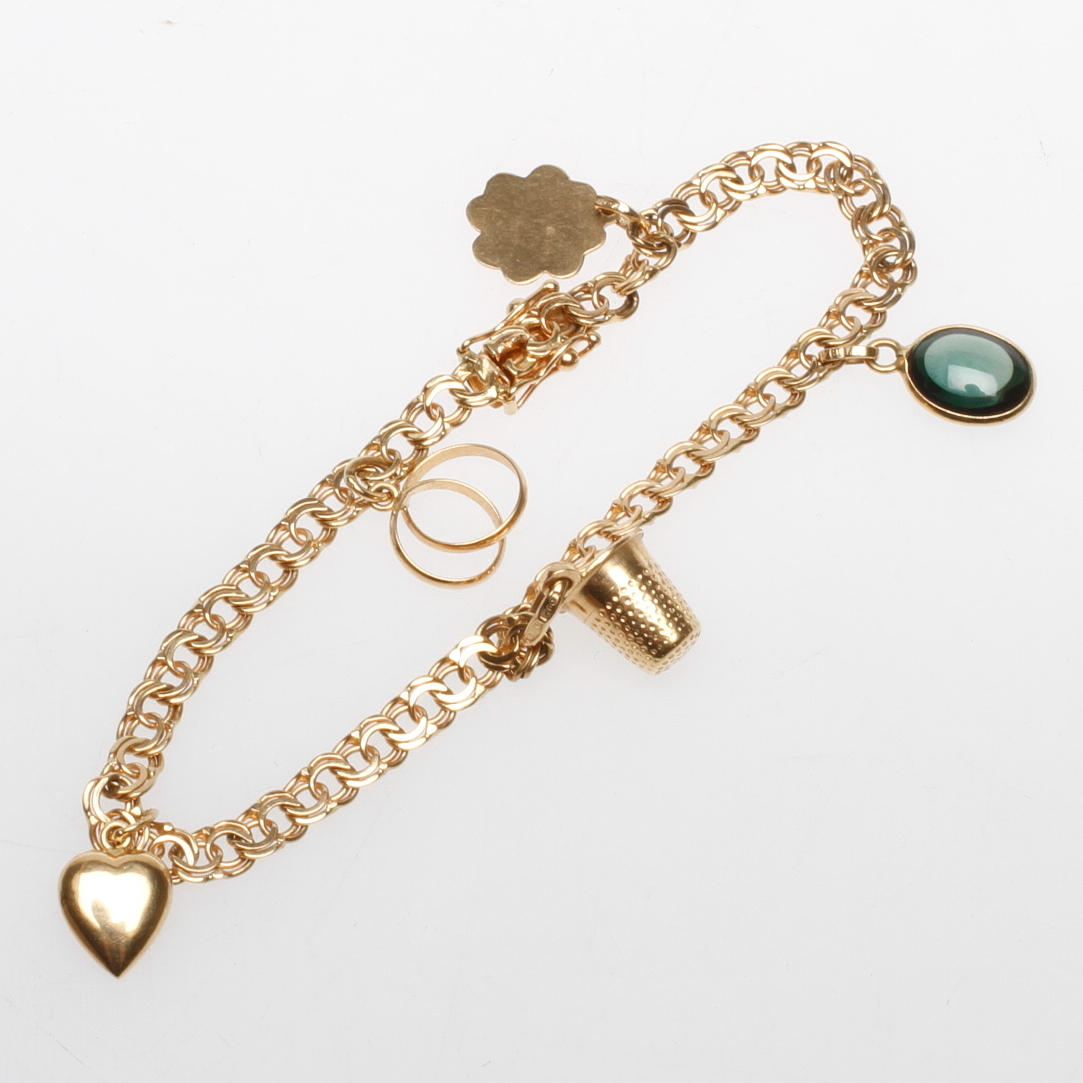 ARMBAND BISMARCK MED BERLOCKER, 18k guld, vikt ca 11 gr.