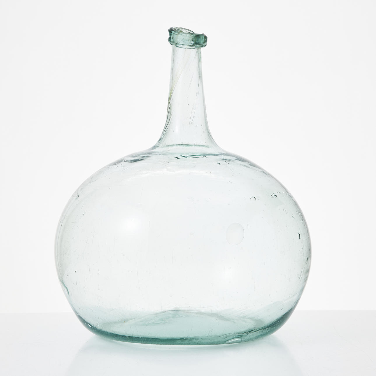 A 17/ 19th century tinted glass bottle.