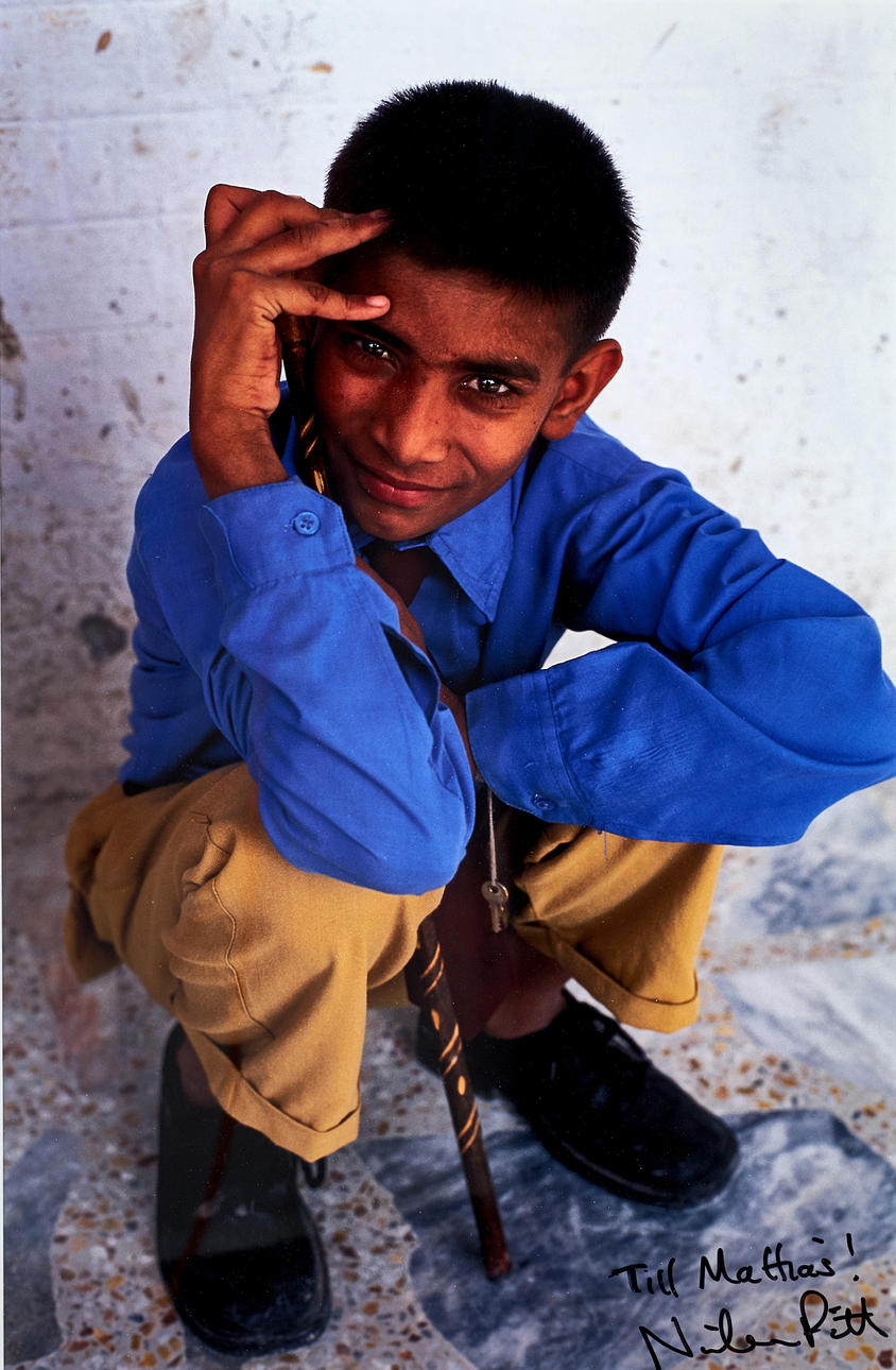 NICHOLAS PITT (contemporary), Seated boy, signed, C-print.