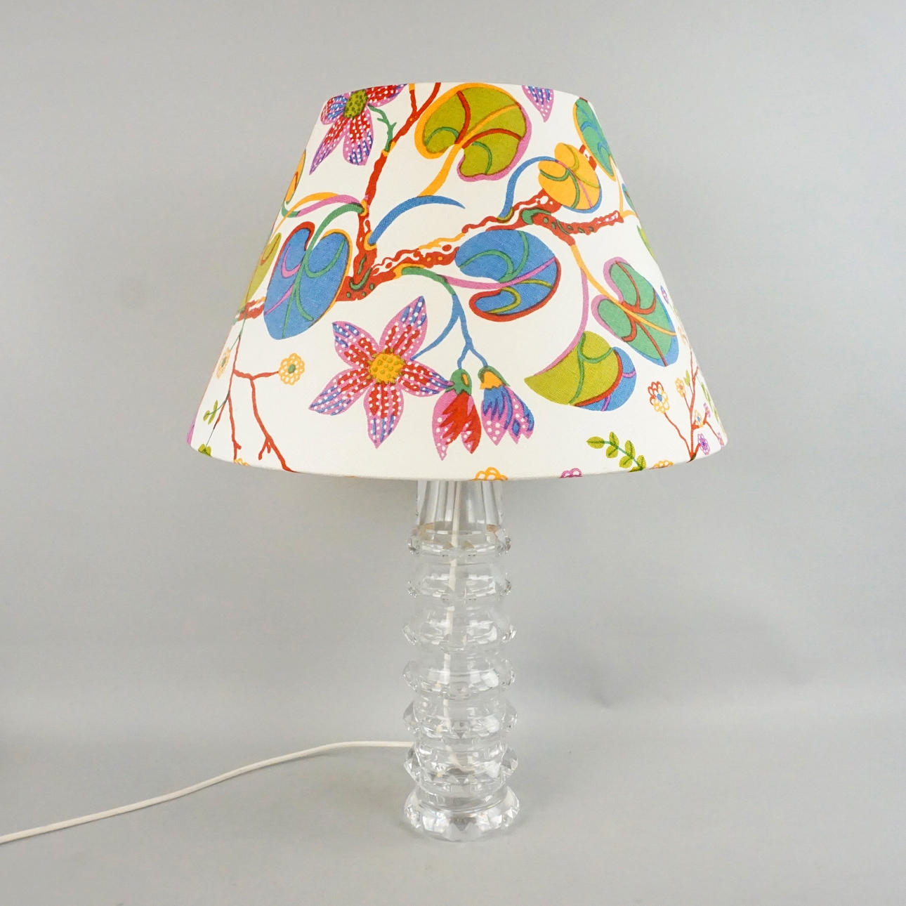 CARL FAGERLUND, A table lamp, signed, Orrefors. A Josef Frank screen from Svenskt Tenn.