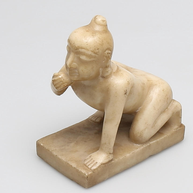 SKULPTUR i marmor 'Baby Krishna', Burma, 18/1900-tal.